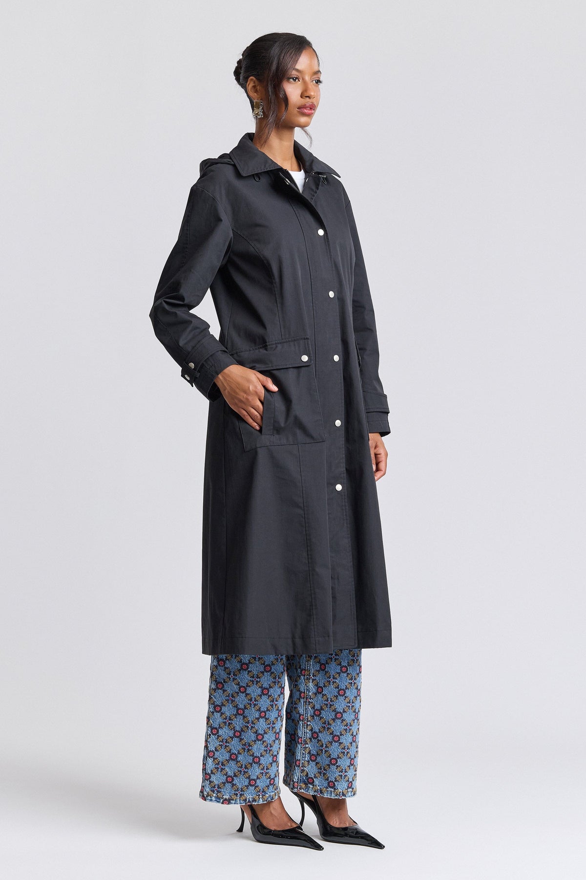 Black raincoat womens with long sleeves and a snap-front - Shop designer long coats by Avec Les Filles.