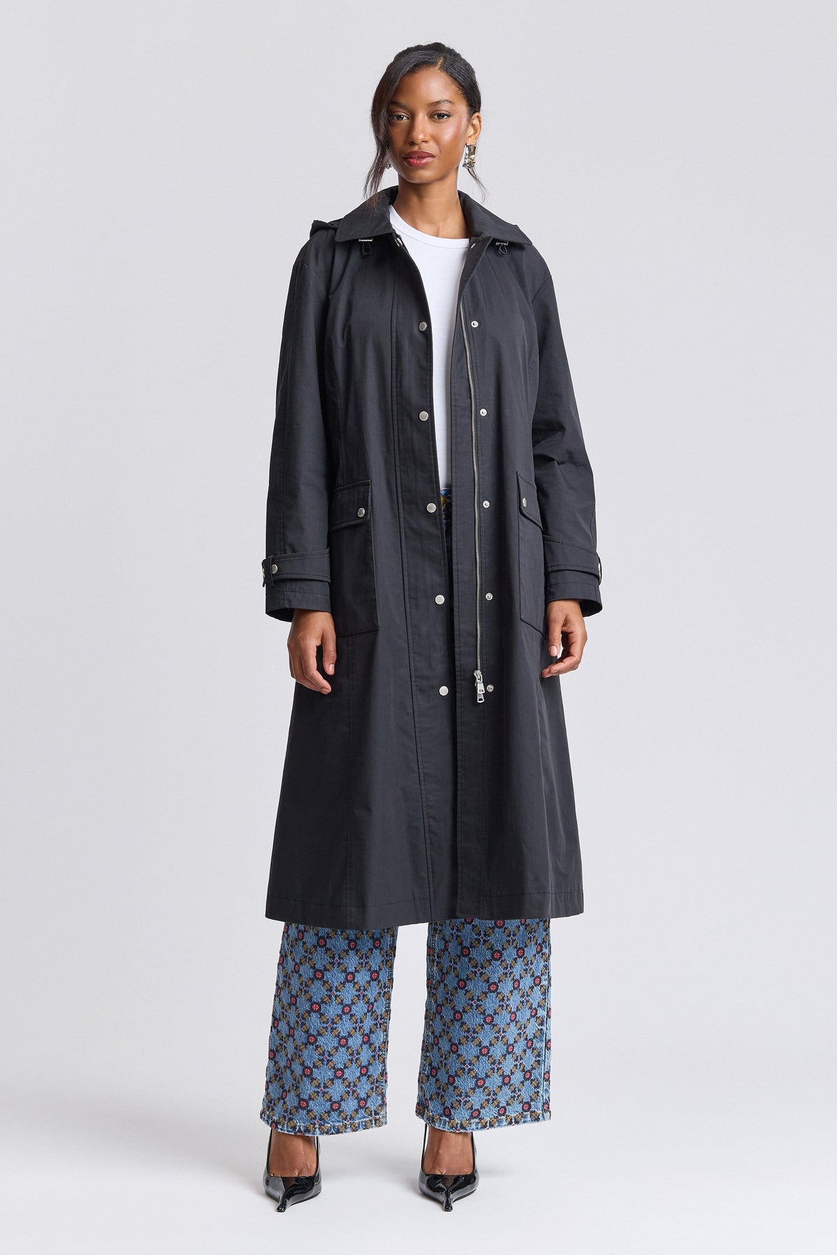 Long black raincoat womens with long sleeves and a snap-front - Shop designer long coats by Avec Les Filles.