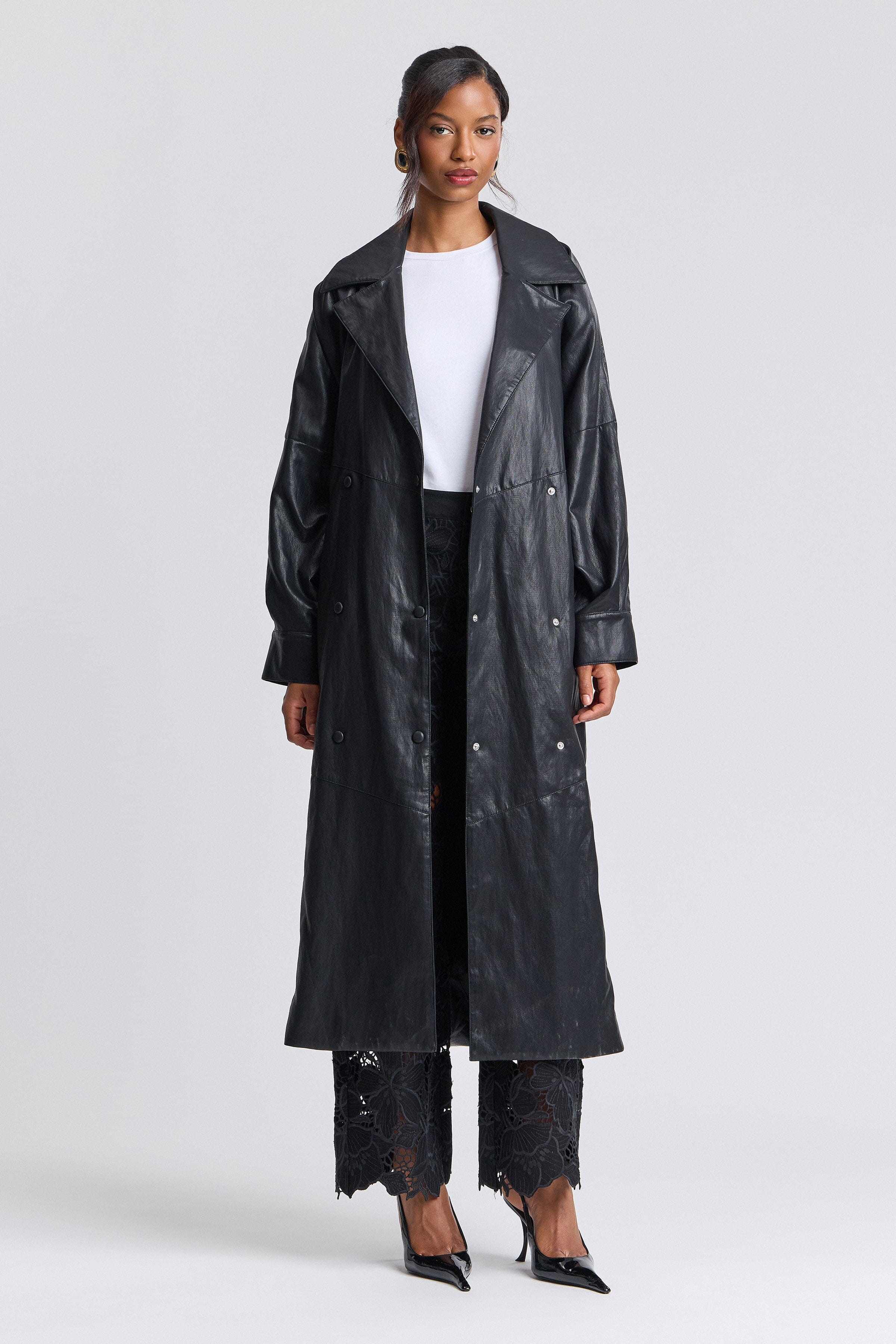 Double-breasted button-front black faux leather trench coat with point collar and adjustable belt - Shop women's cute trench coats by Avec Les Filles.