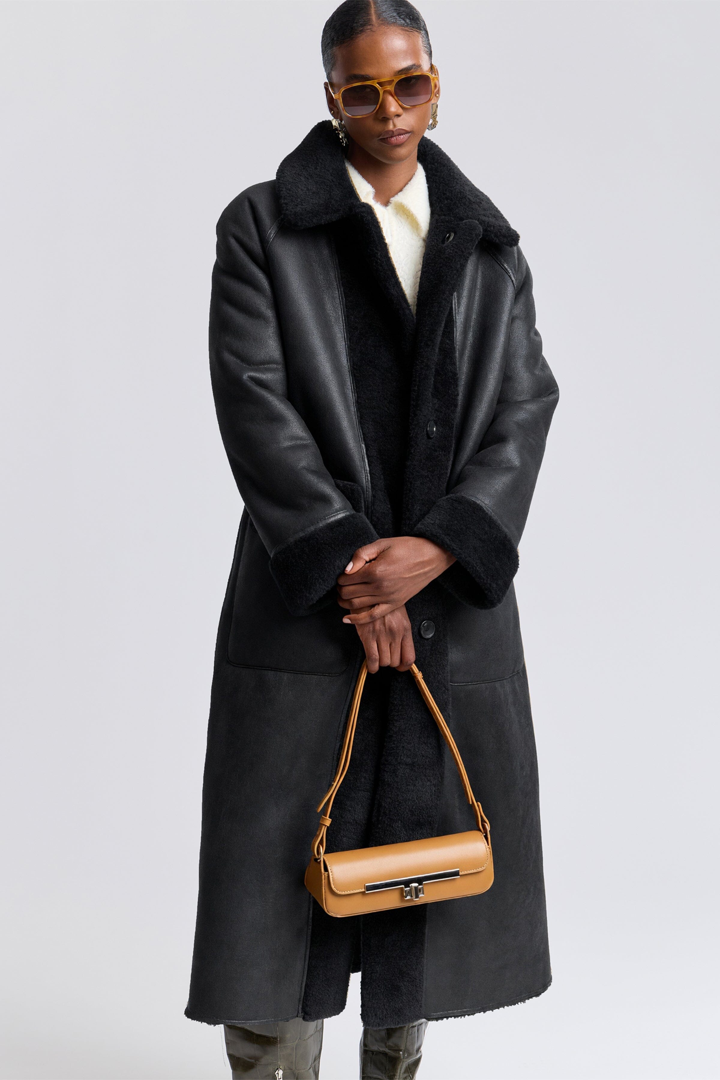 Reversible faux black shearling long coat with raglan sleeves - Shop women's shearling coats by Avec Les Filles.