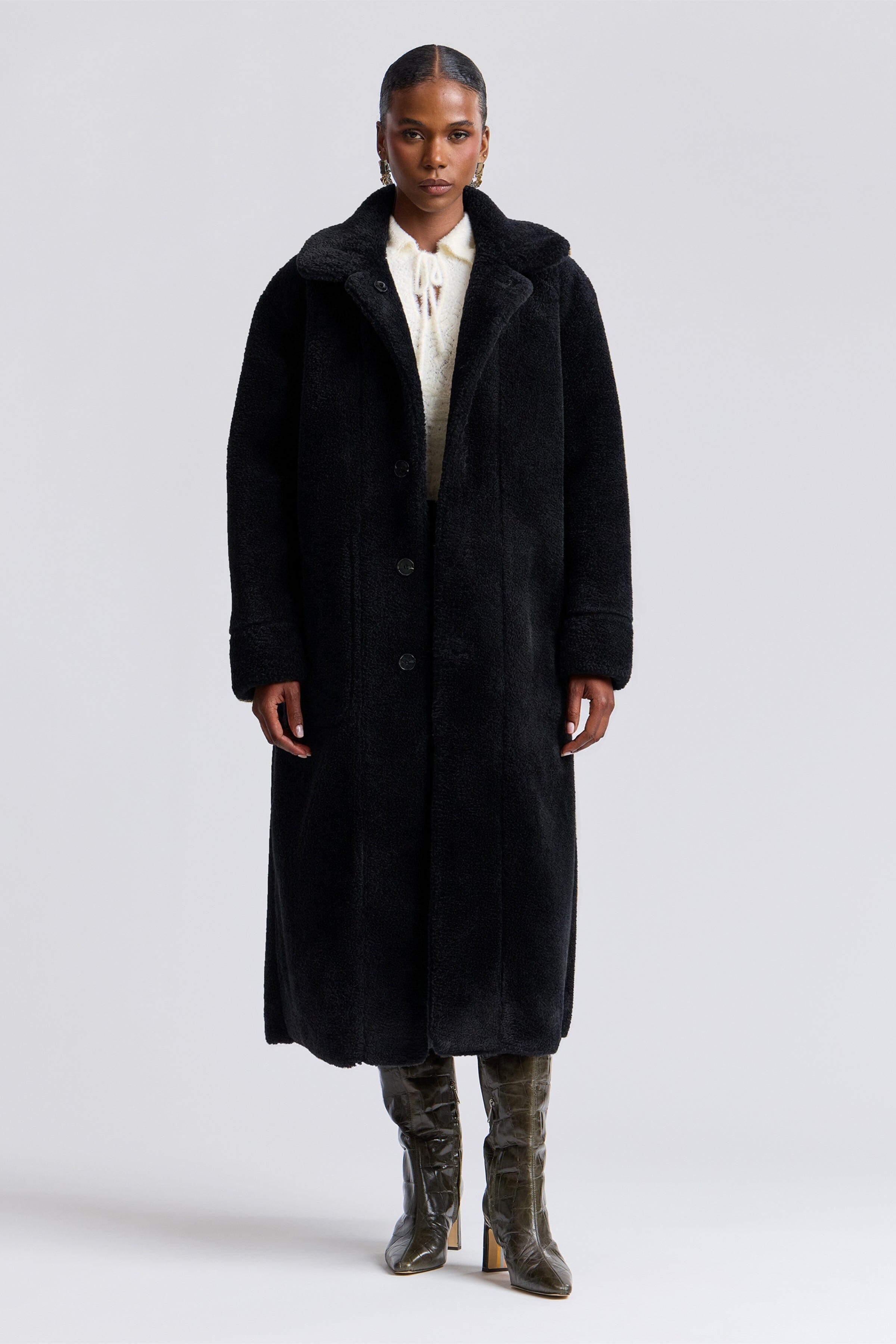 Reversible black faux shearling coat with front button and raglan sleeves - Shop women's maxi coats by Avec Les Filles.