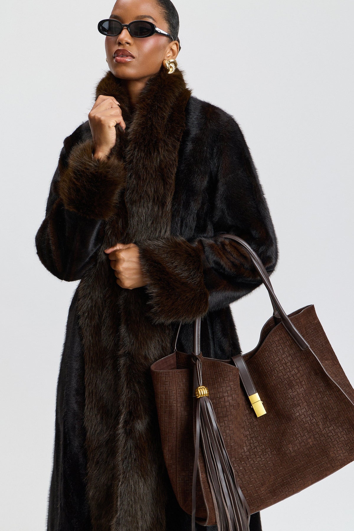 Tipped fit-and-flare black faux fur full length coat with shawl collar. Shop cute faux fur jackets by Avec Les Filles.