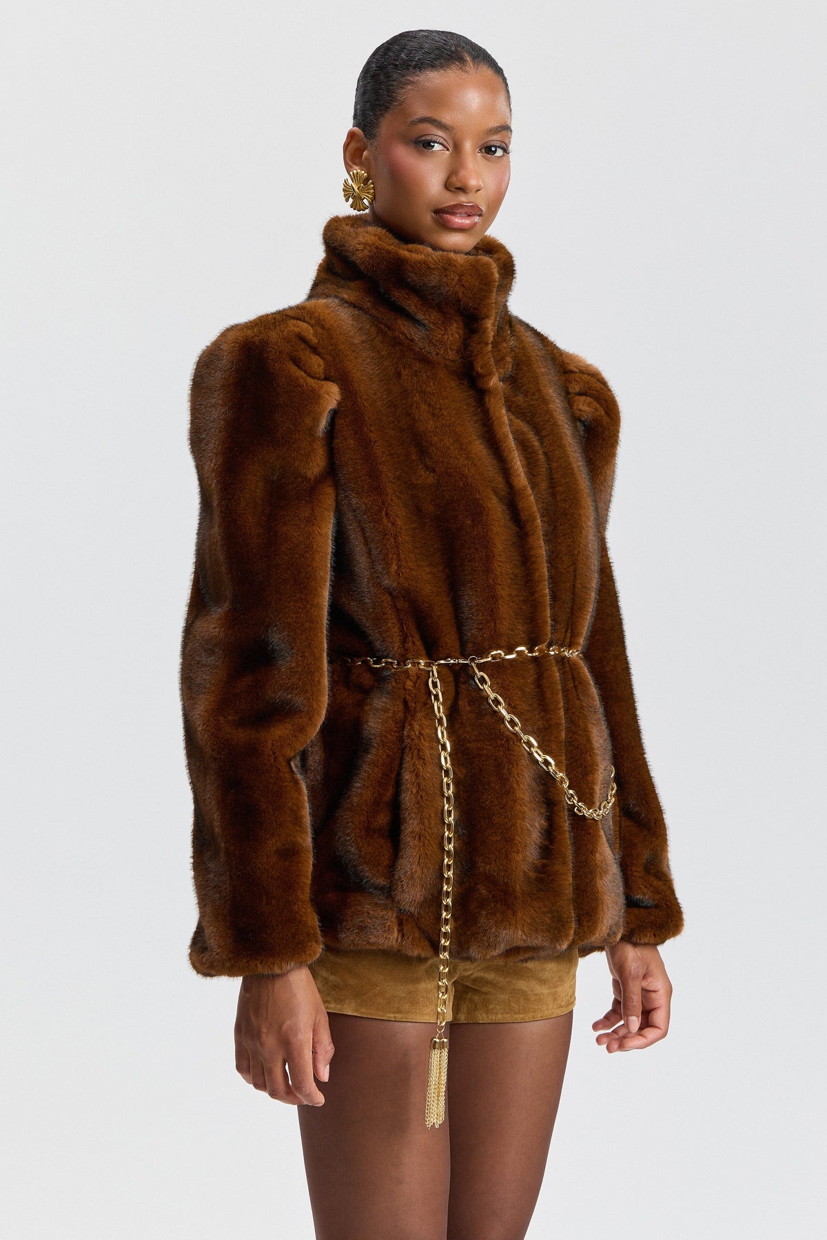 Brown faux fur coat with a chain belt and high stand collar. Shop designer women's cute faux fur jackets by Avec Les Filles.