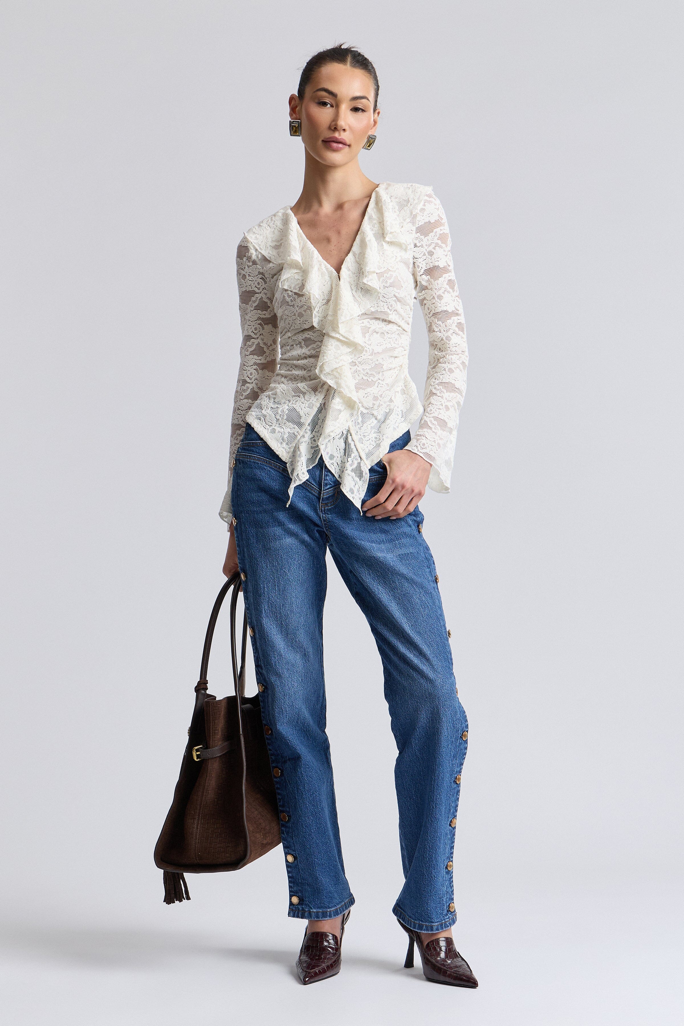 Embellished blue button side jeans with a high-rise waistband. Shop women's cute denim jeans by Avec Les Filles.