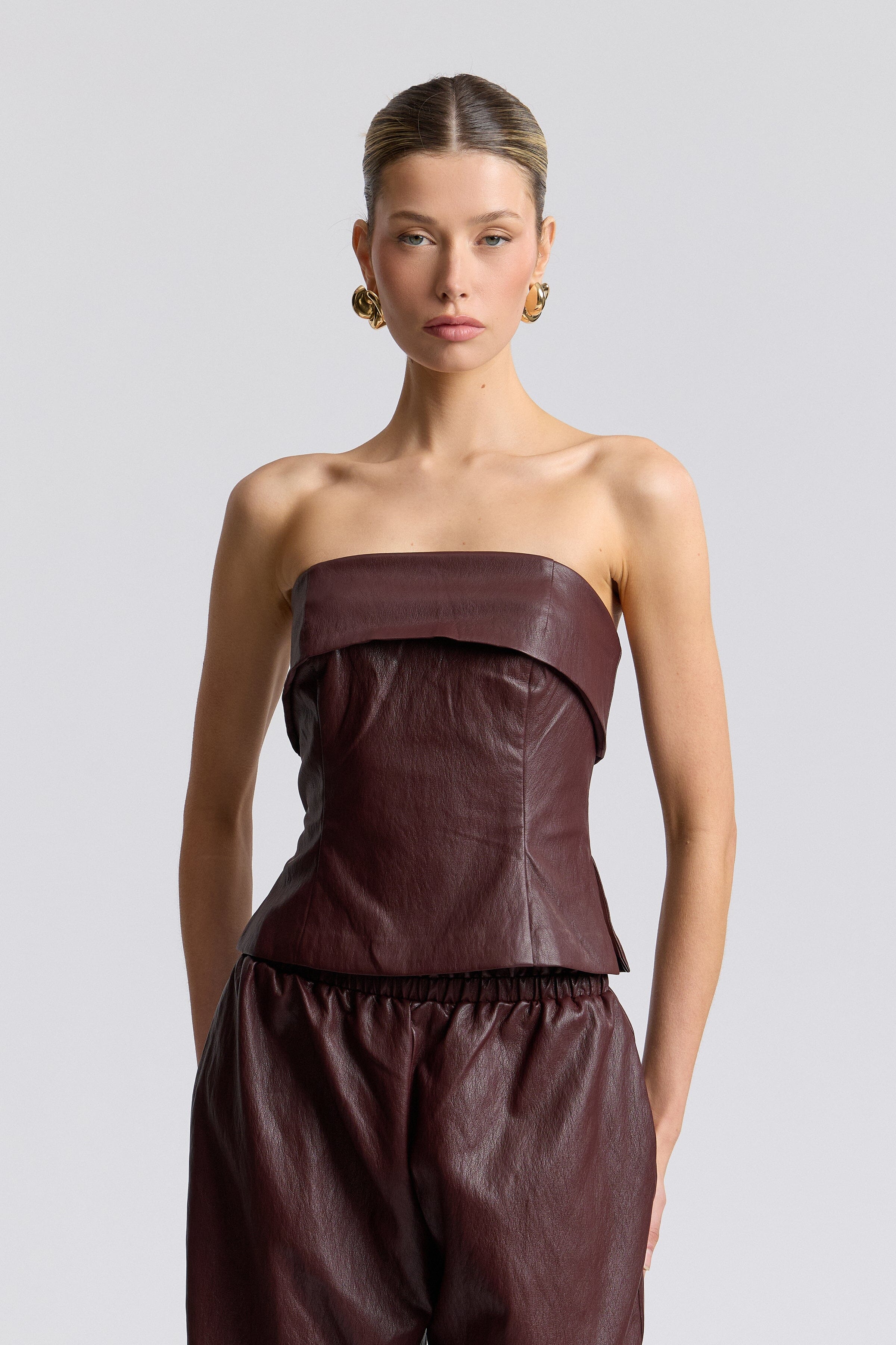 Dark brown faux leather tube top with foldover neck and side slits - Shop women's tube tops by Avec Les Filles.