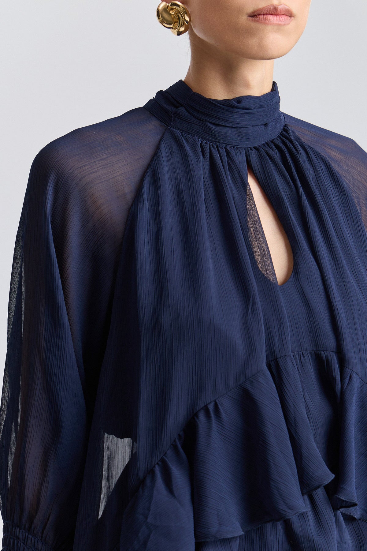 Ruffle blue flowy top with long sleeves and a high-low layered hem - Shop cute navy blue tops by Avec Les Filles.