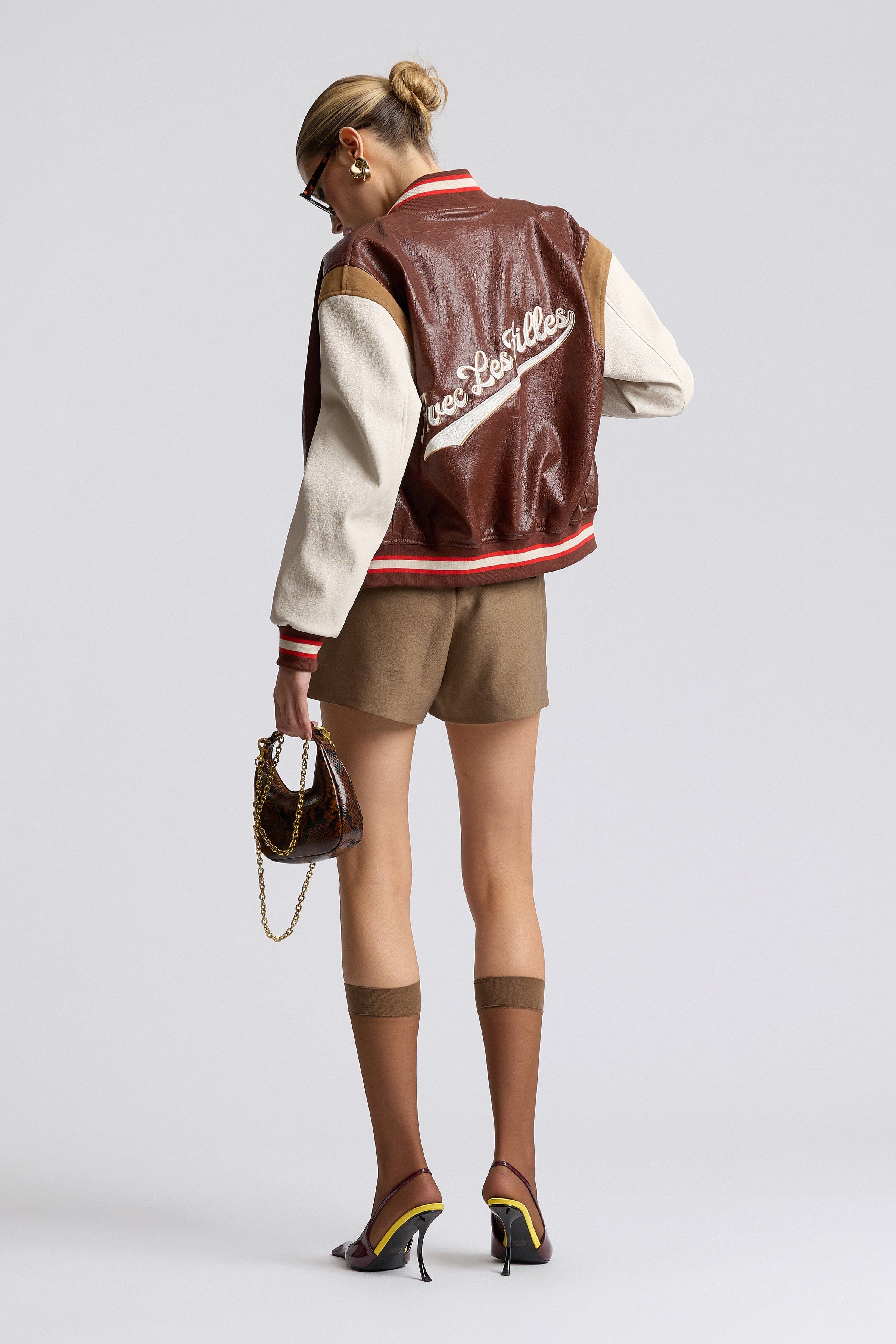 Faux-leather varsity red jacket with a snap-button front and long sleeves - Shop cute varsity jackets by Avec Les Filles.