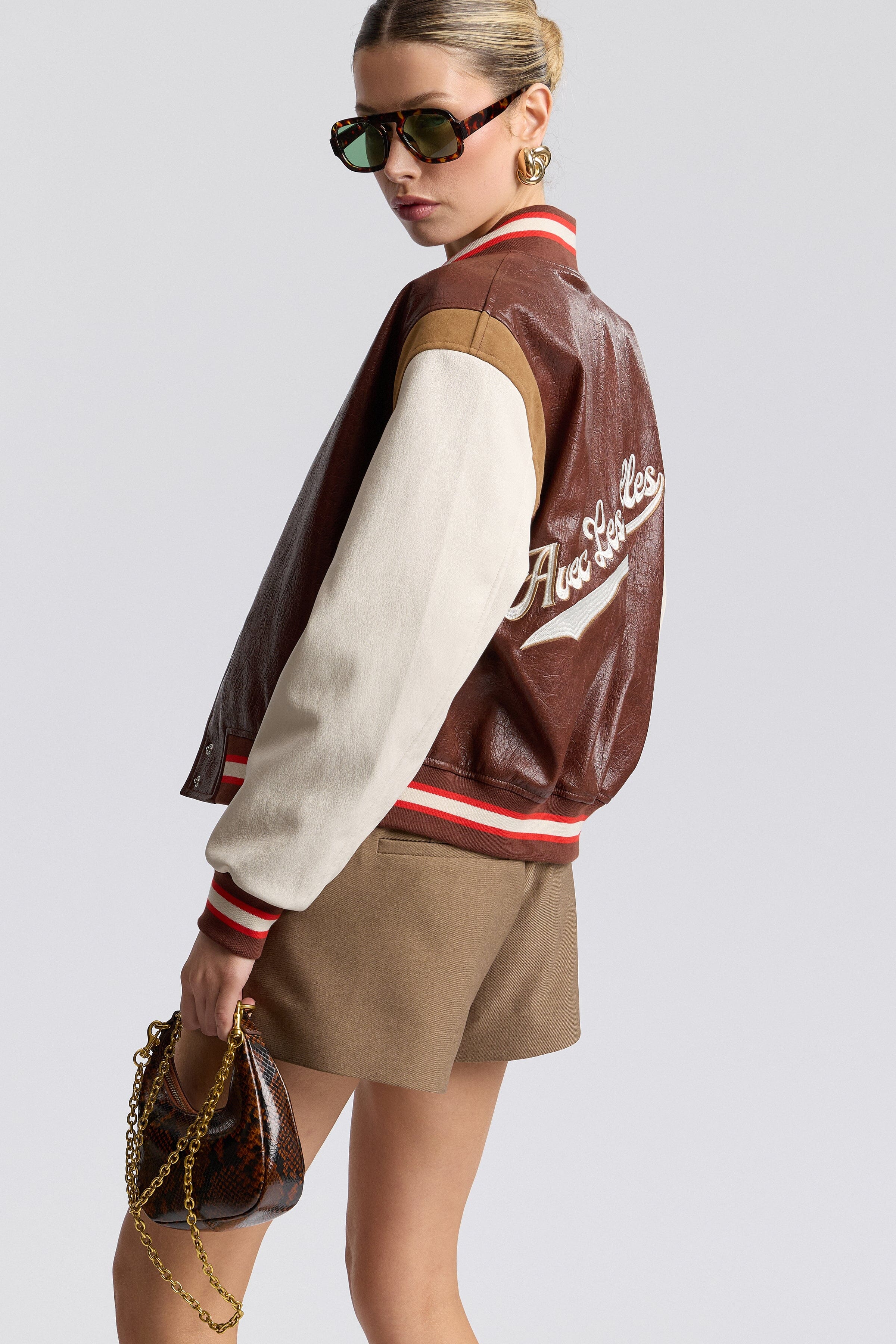 Faux-leather red varsity jacket with a snap-button front and long sleeves - Shop clothing varsity jacket by Avec Les Filles.