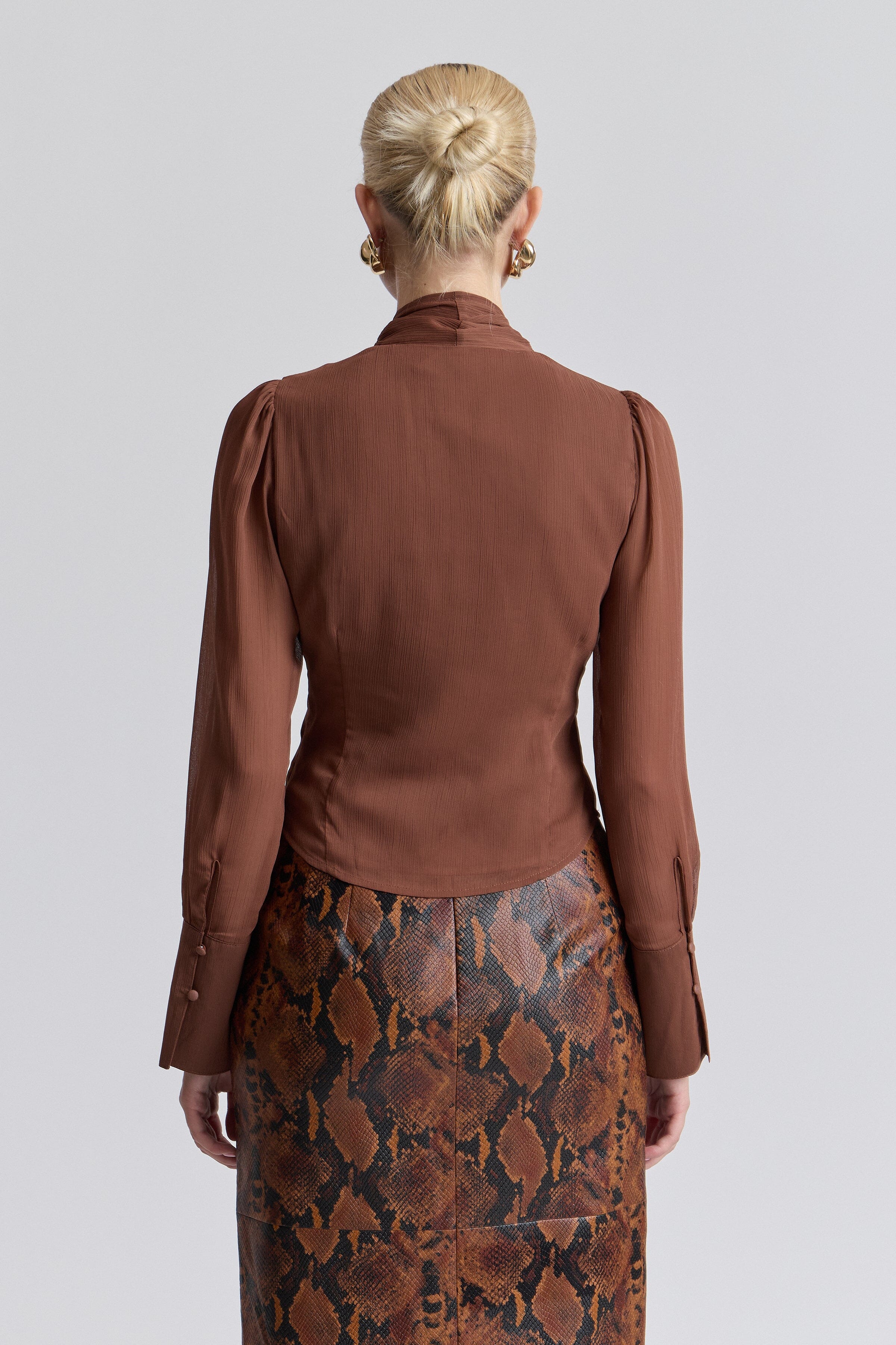 Brown hiffon long sleeve blouse with a faux-button front - Shop women's cute tops by Avec Les Filles.