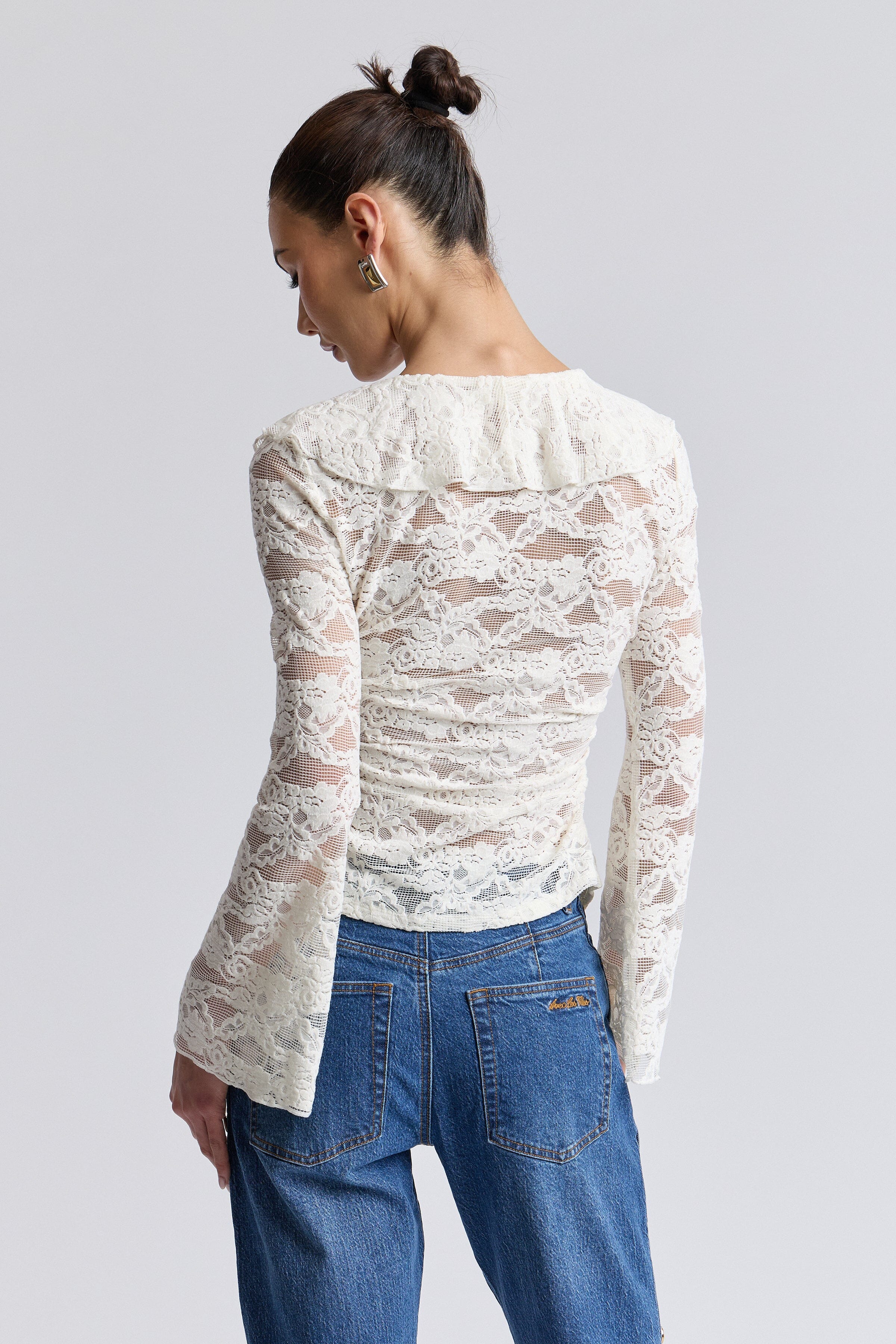 Cream lace top with long sleeves. Shop women's cute ruffle tops by Avec Les Filles.