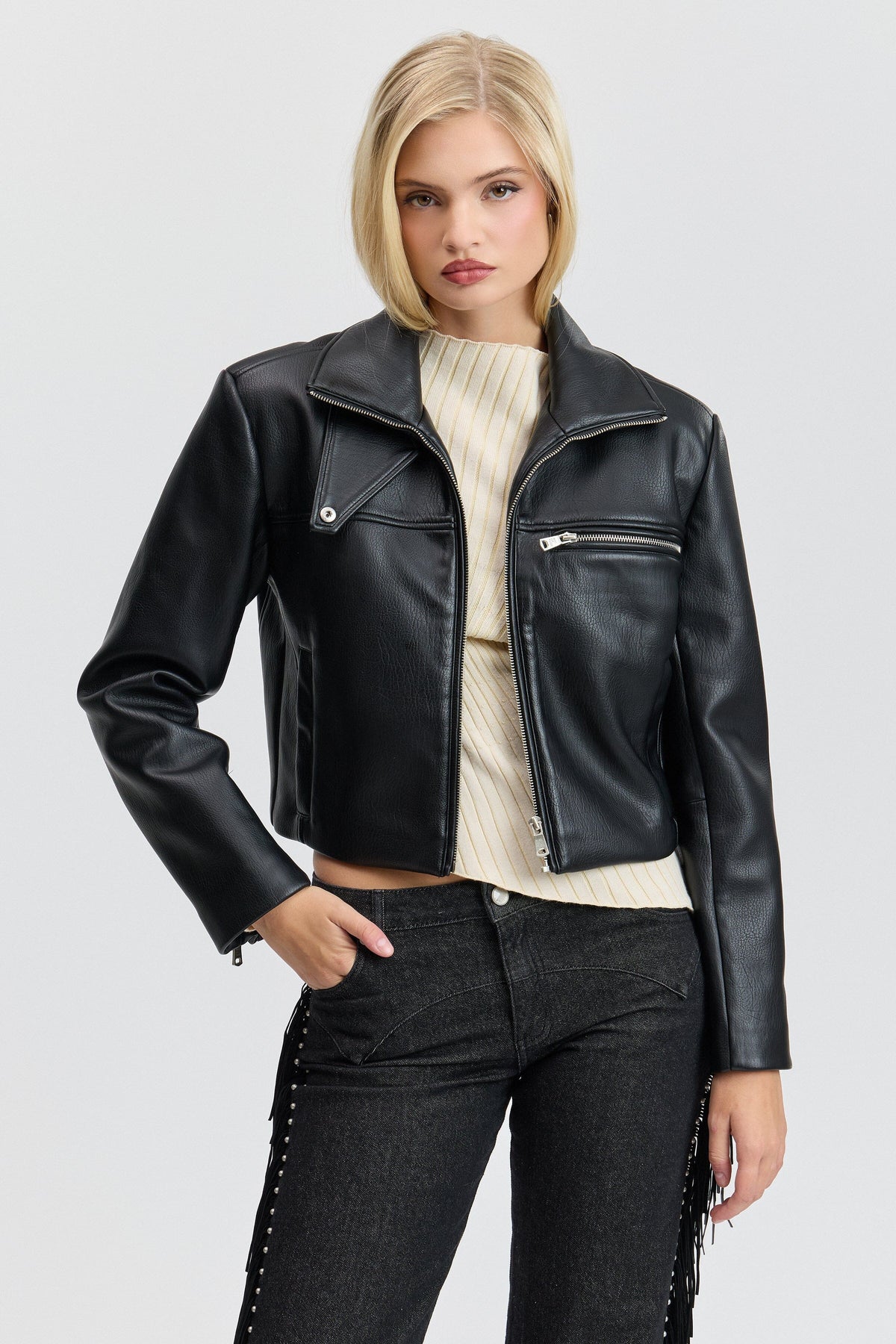 Strong-shoulder black leather cropped jacket with front zipper. Shop women's cute cropped jackets by Avec Les Filles.