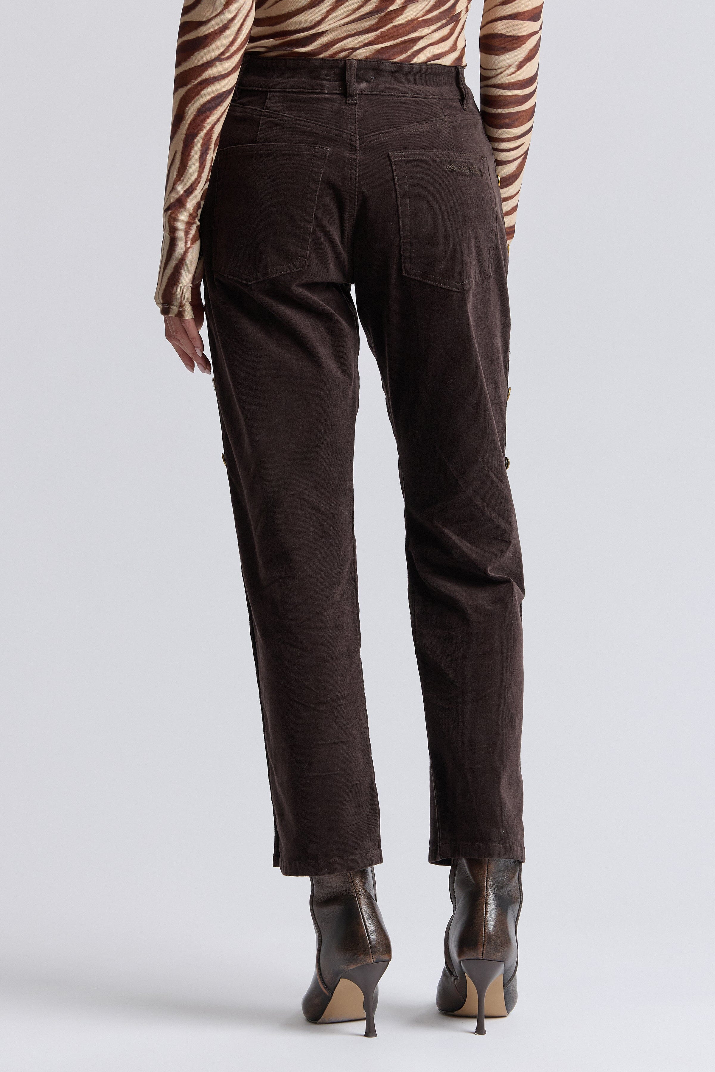 Straight-leg corduroy brown pants in a cotton blend with mid-rise. Shop brown cord womens trousers by Avec Les Filles.