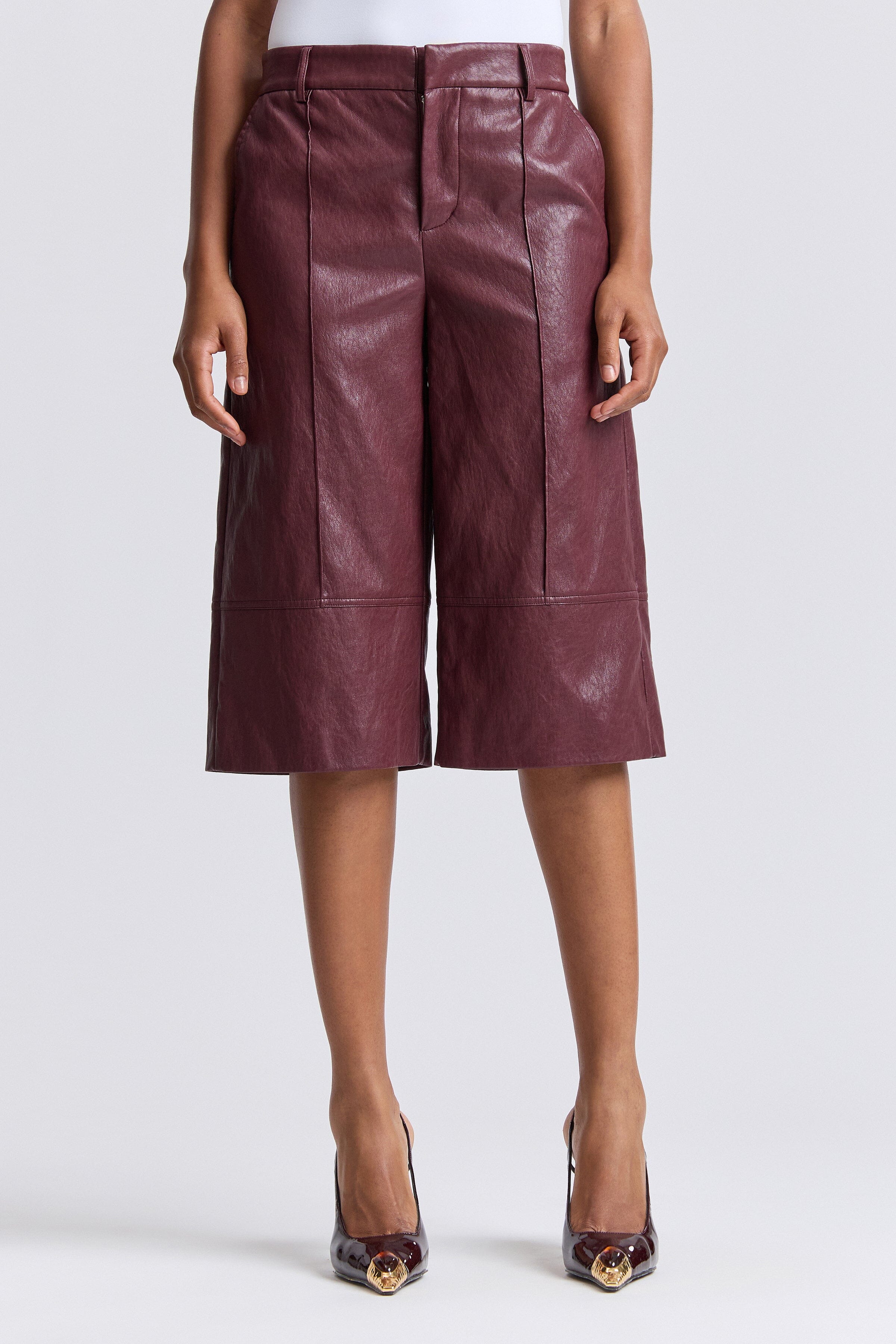 Wide-leg wine faux leather culottes have a high waist - Shop designer women's culottes pants by Avec Les Filles.