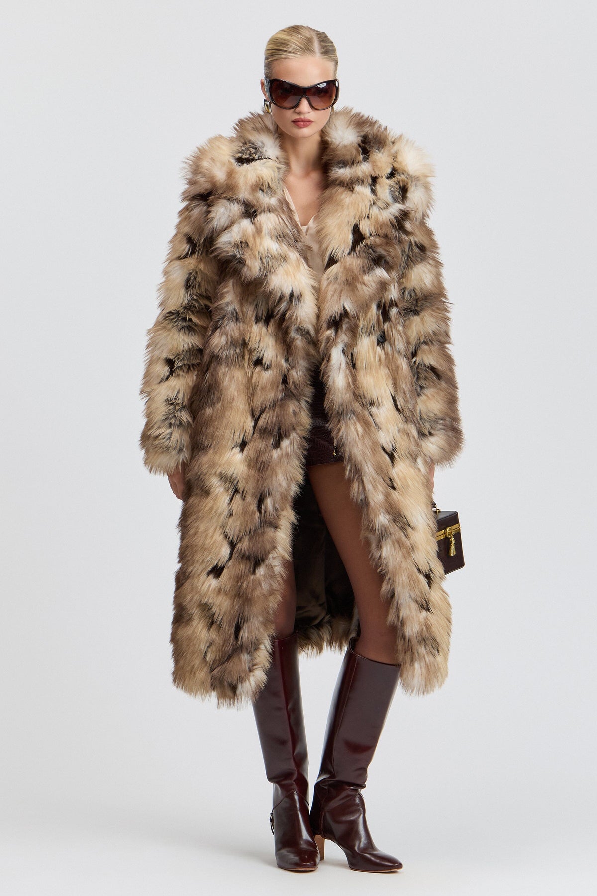 Brown long faux fur coat with a wide collar. Shop designer women's cute fur coats by Avec Les Filles.
