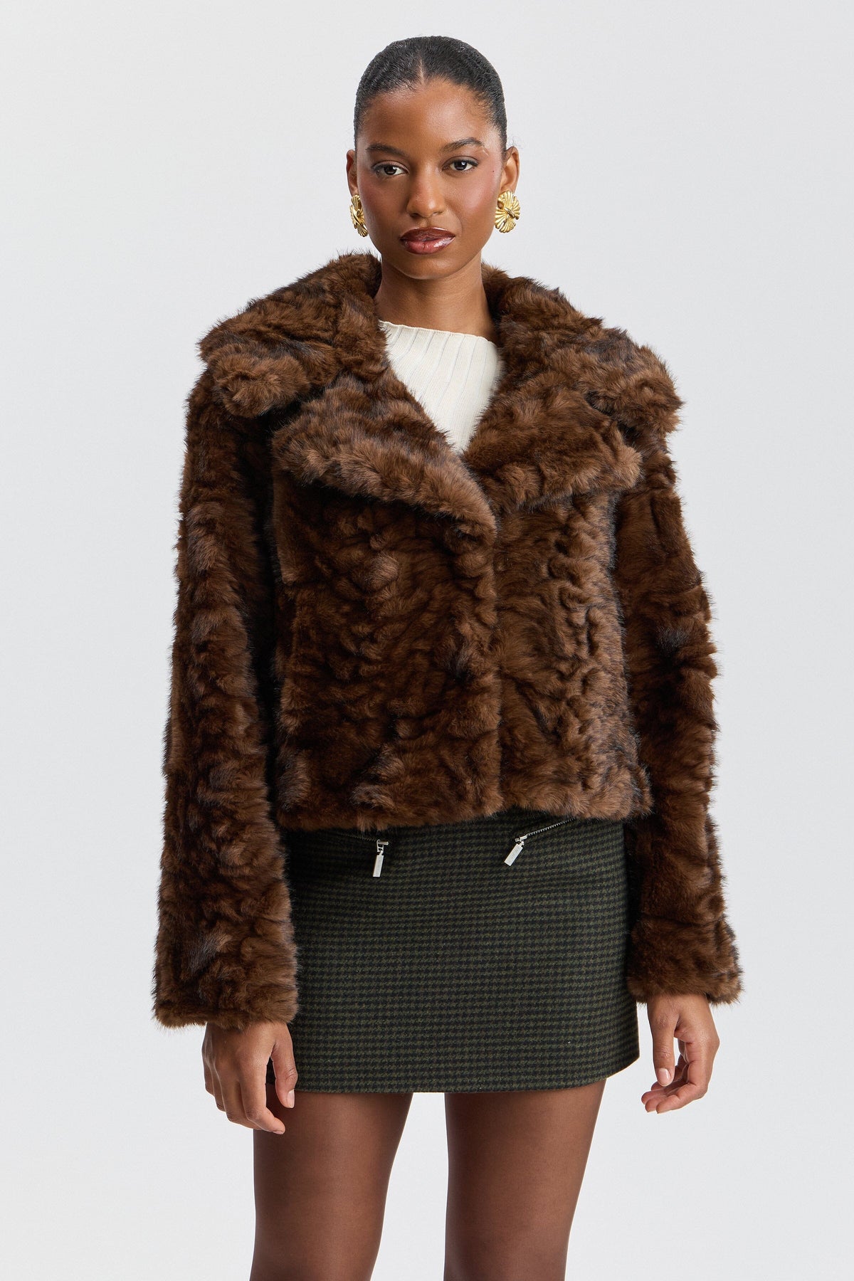 Brown short faux fur jacket with a center-front and notched collar. Shop women's cute brown jackets by Avec Les Filles.