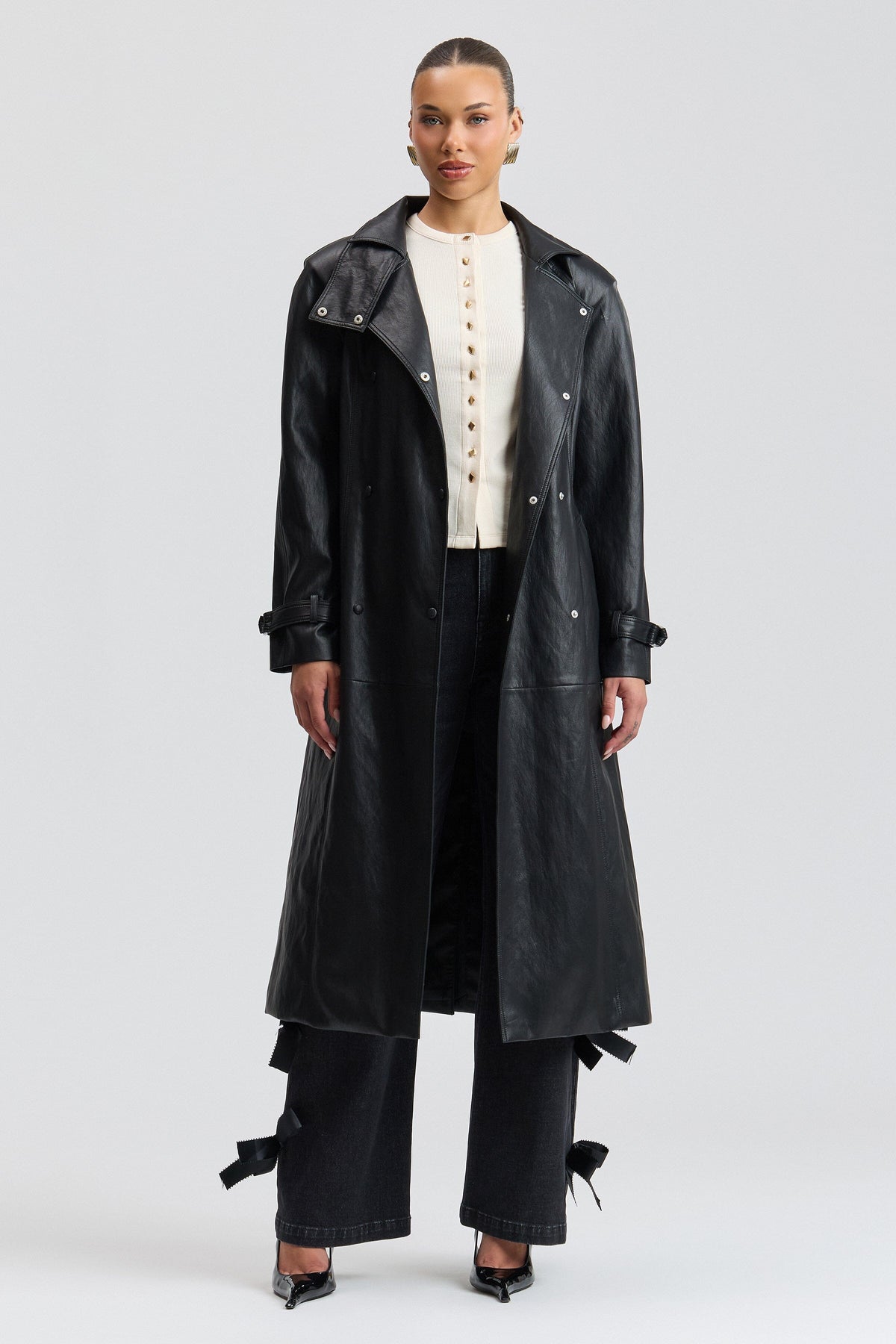 Double-breasted belted black faux leather trench coat with a funnel neck and raglan sleeves by Avec Les Filles.