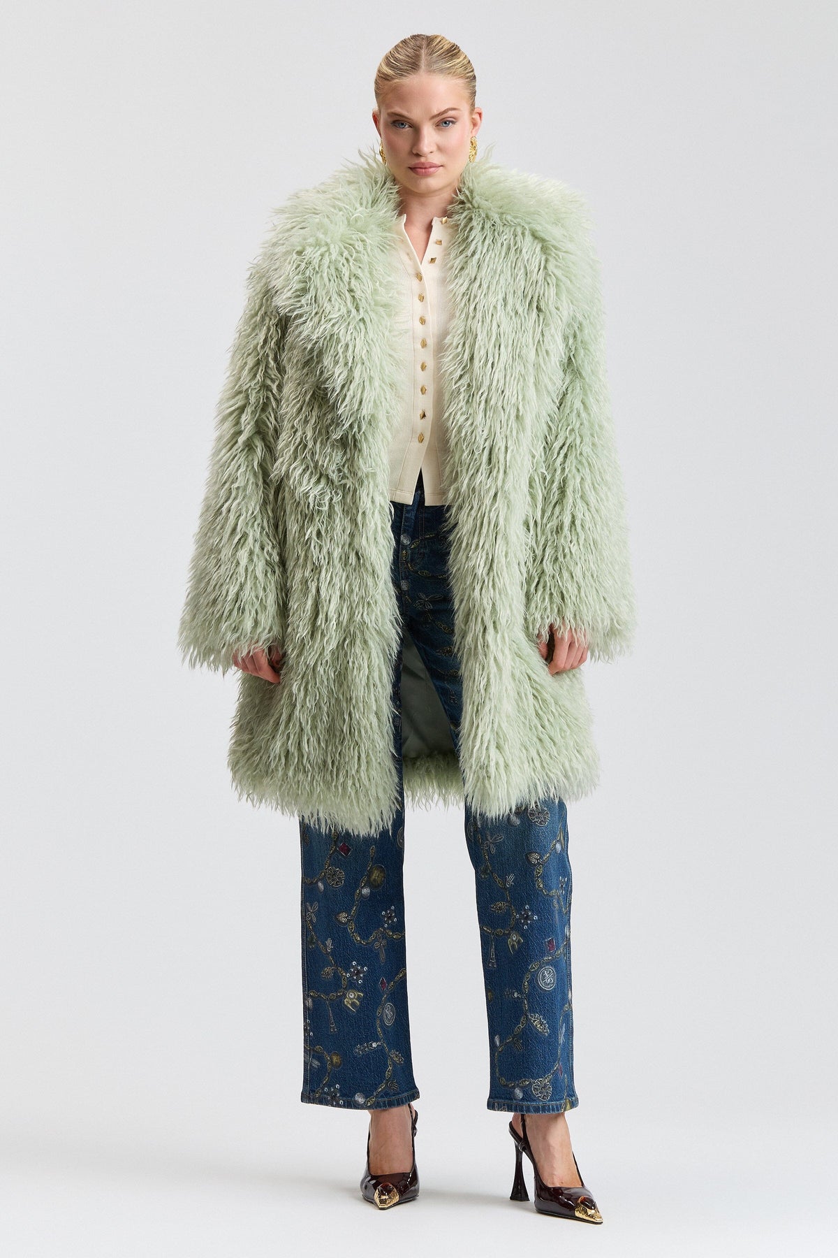 Notch-collar shaggy green faux fur coat with a center front. Shop women's cute green fur coats by Avec Les Filles.