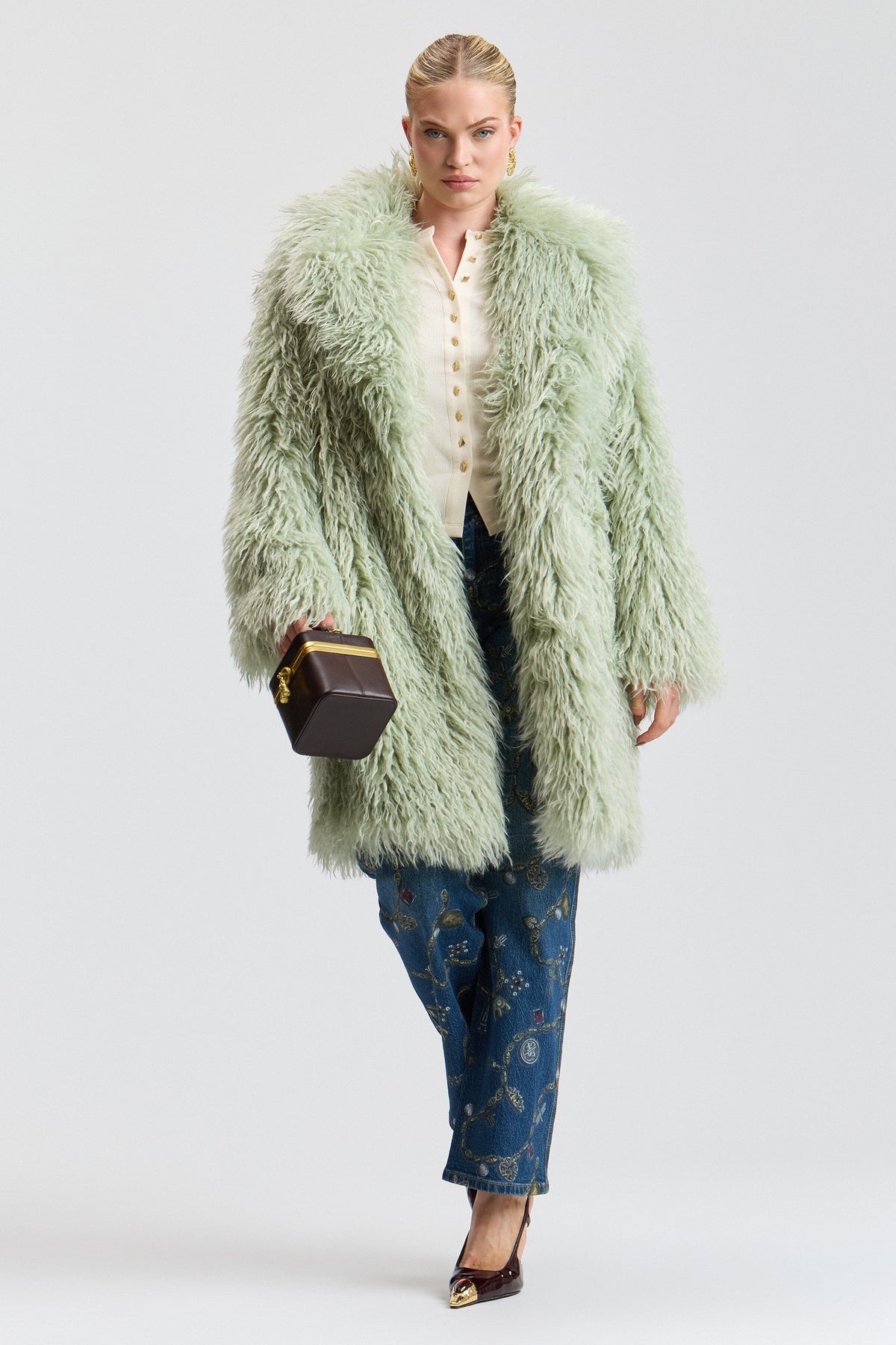 Notch-collar shaggy green fur coat with a center front. Shop designer women's cute green fur coats by Avec Les Filles.