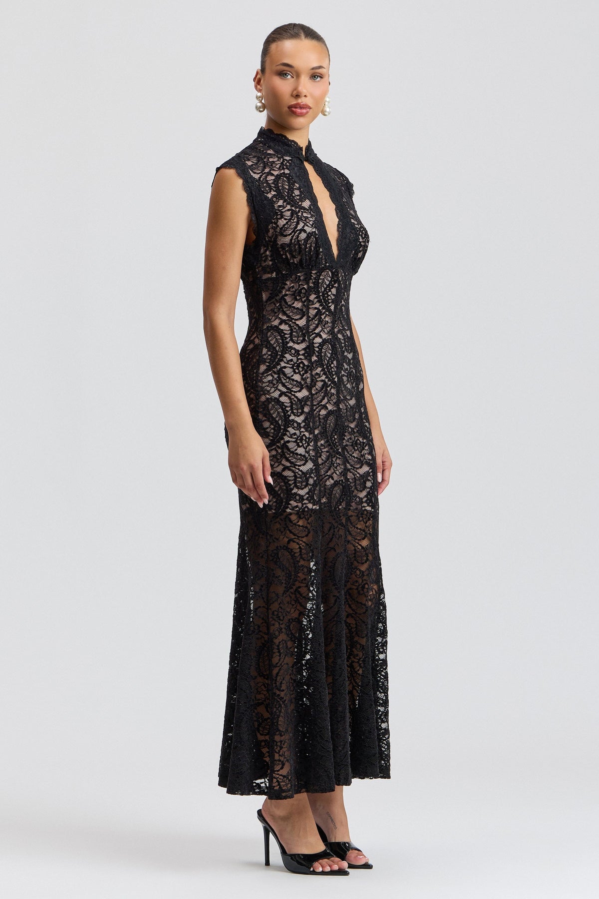 Sleeveless lace black party dress with fitted fluted skirt. Shop designer women's black lace dresses by Avec Les Filles.