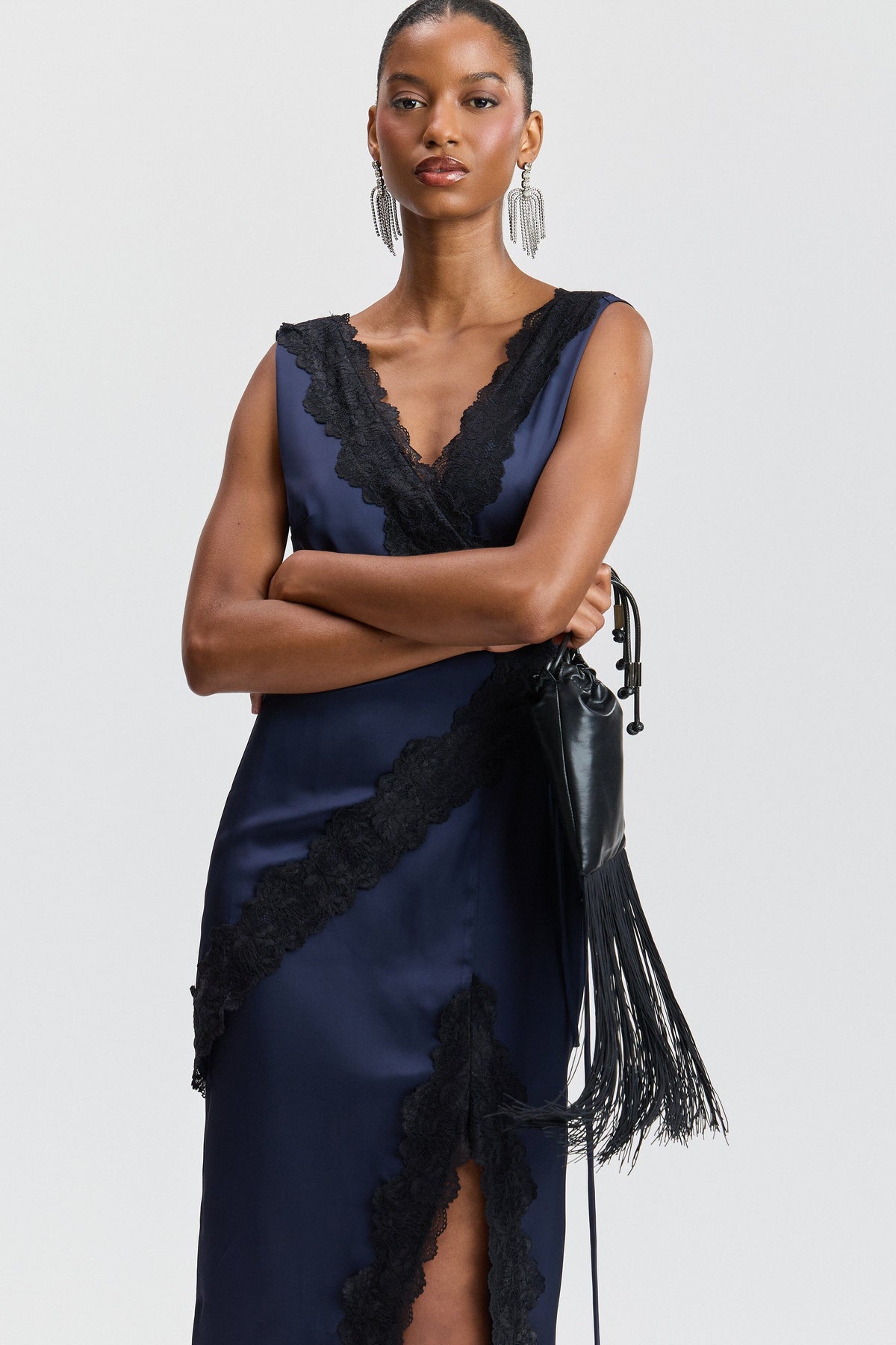 Navy blue wrap satin and lace dress with deep V-neck and drawstring tie waist. Shop maxi dresses by Avec Les Filles.