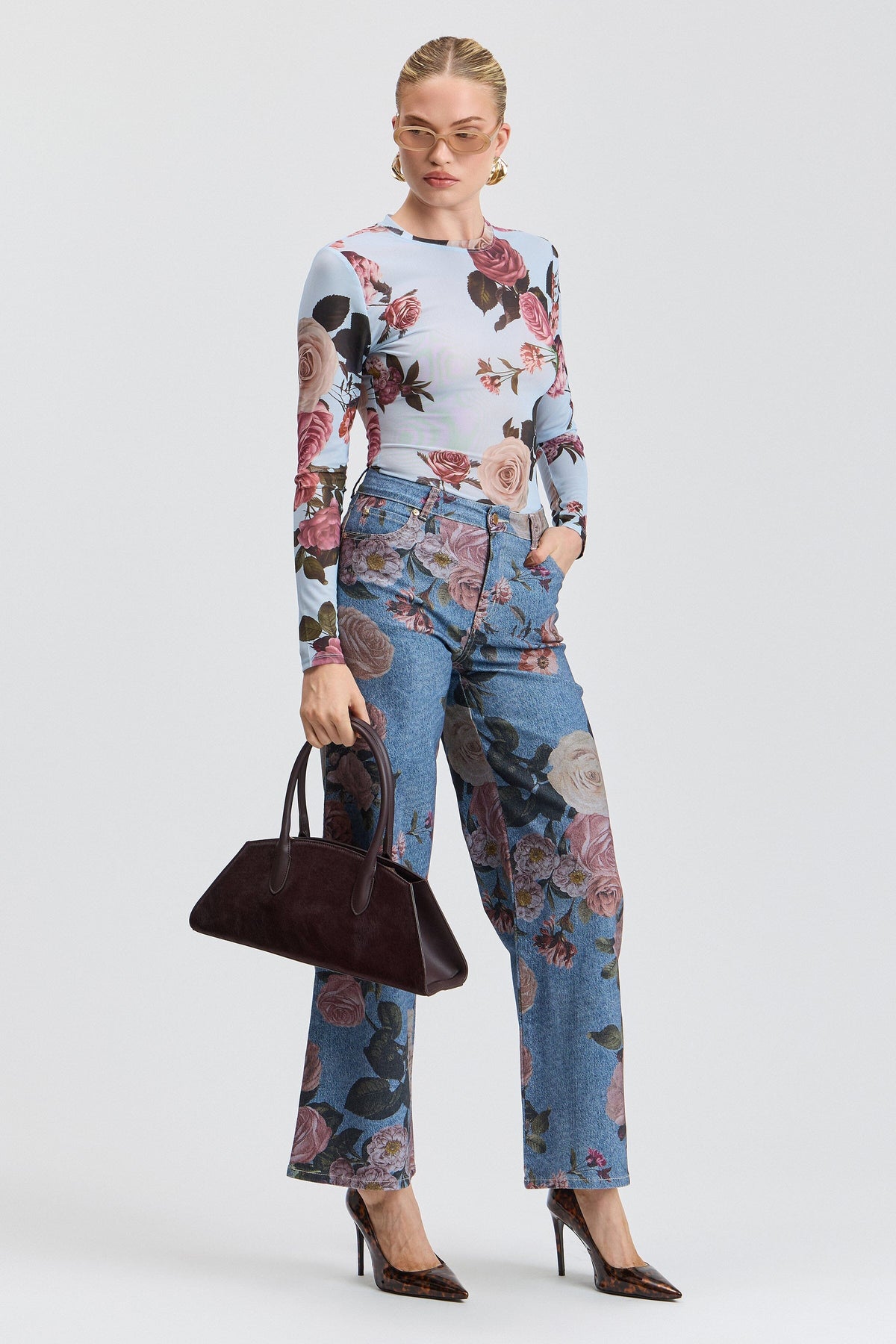 Blue denim floral jeans with a high-rise waist and pockets. Shop women's wide leg denim jeans by Avec Les Filles.