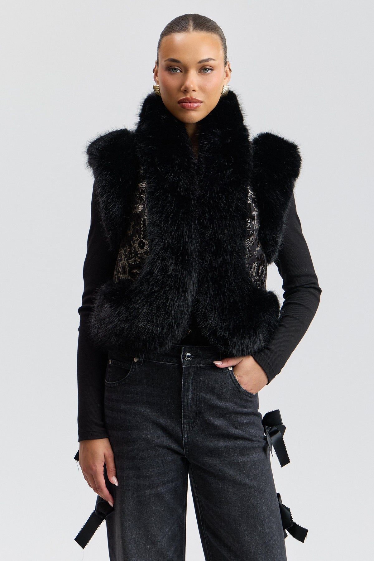 Black vest faux has a cropped length and an open front - Shop designer faux fur vests for women by Avec Les Filles.