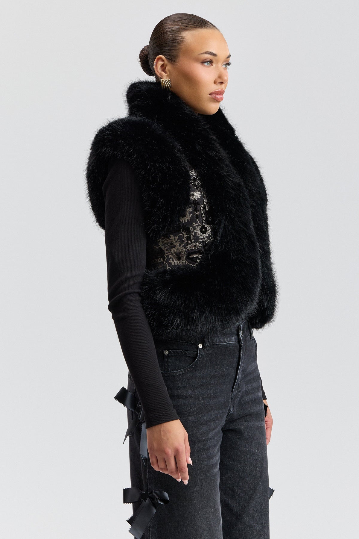 Black faux fur vest women has a cropped length and an open front - Shop designer vests by Avec Les Filles.