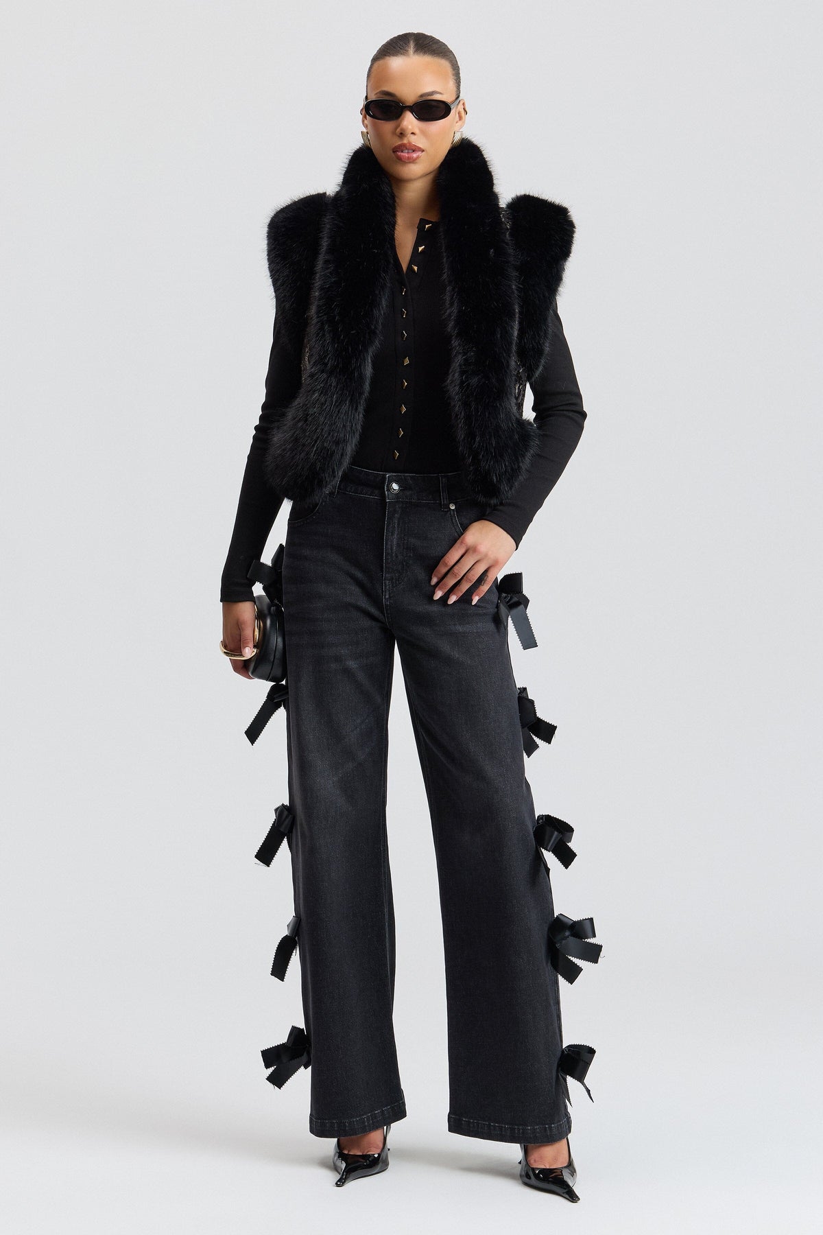 Black synthetic fur vest has a cropped length and an open front - Shop faux fur vests for women by Avec Les Filles.