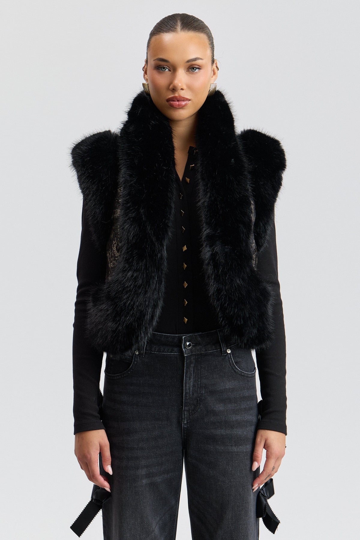 Black faux fur vest has a cropped length and an open front - Shop faux fur vests for women by Avec Les Filles.