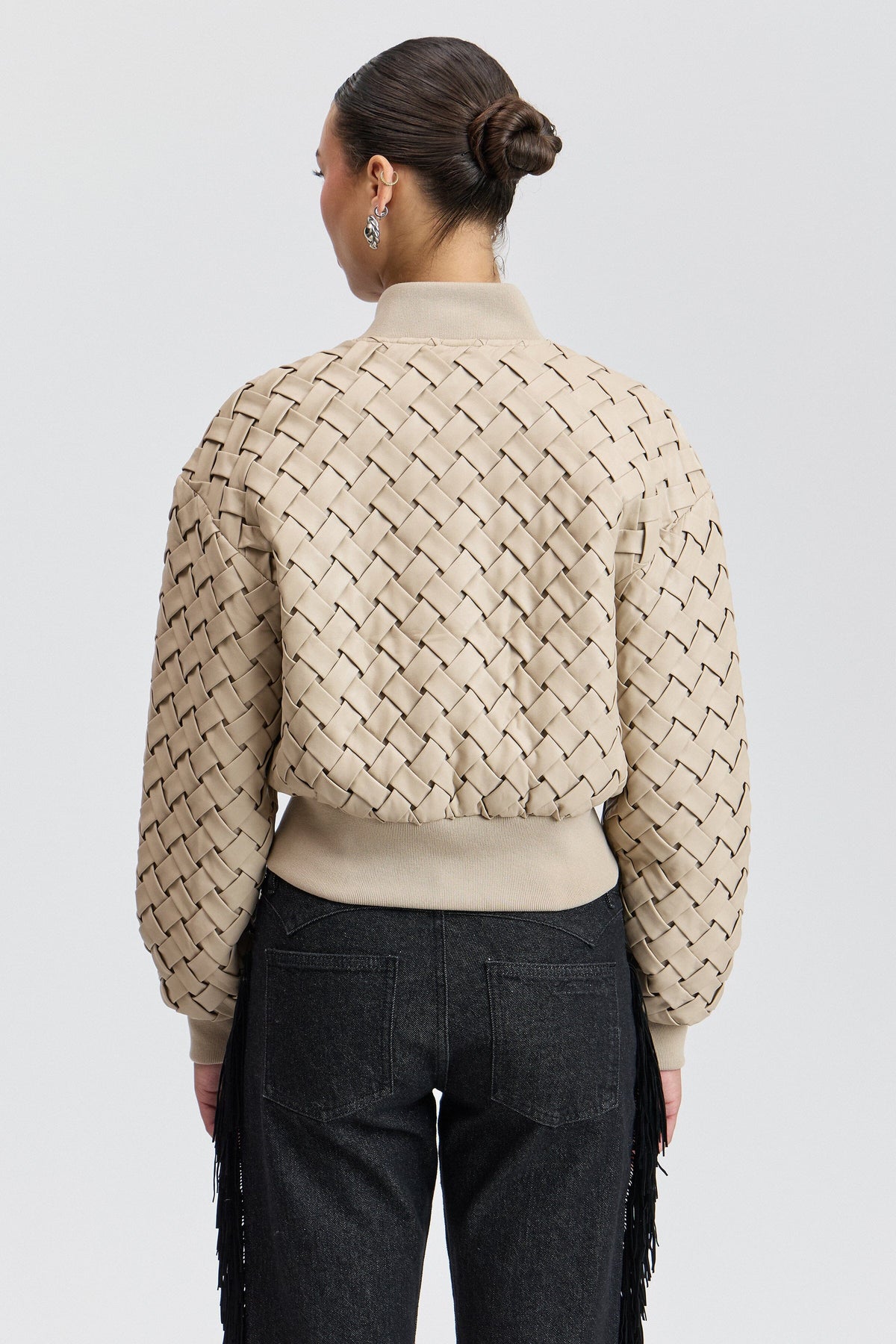 Cream womens faux leather bomber jacket with a rib-knit collar. Shop designer faux leather jackets by Avec Les Filles.