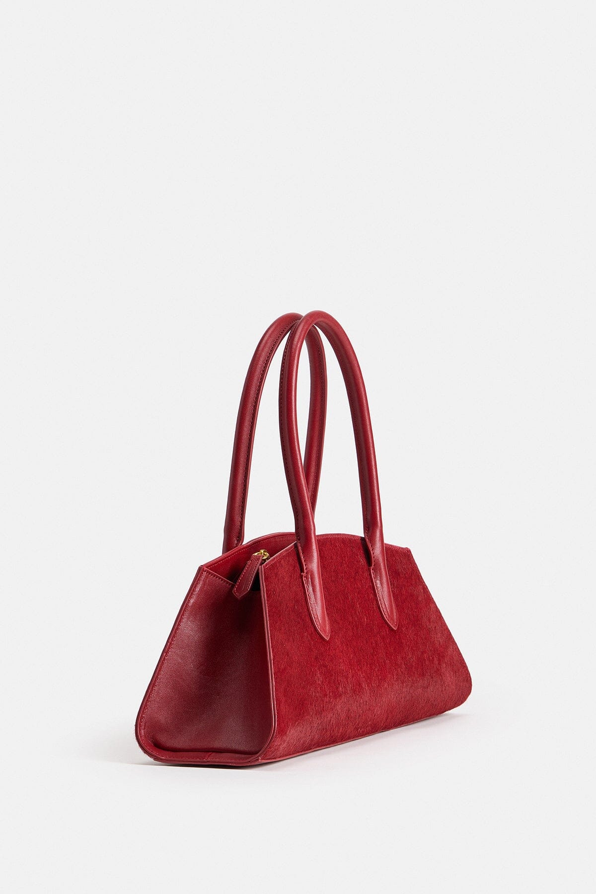 Red shoulder hand bags is crafted from 100% genuine leather with dual leather top handles by Avec Les Filles.