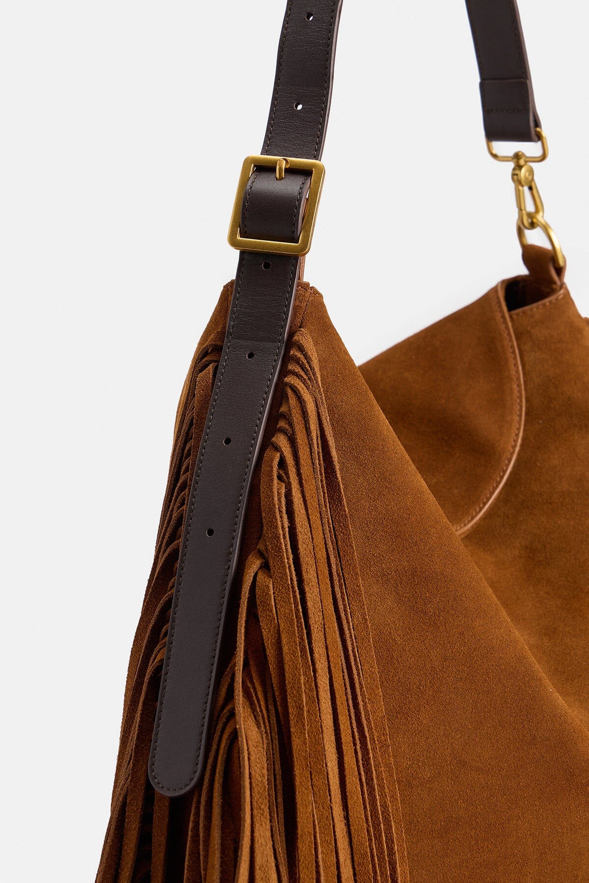 Fringe brown bag in genuine leather with adjustable leather shoulder strap by Avec Les Filles.