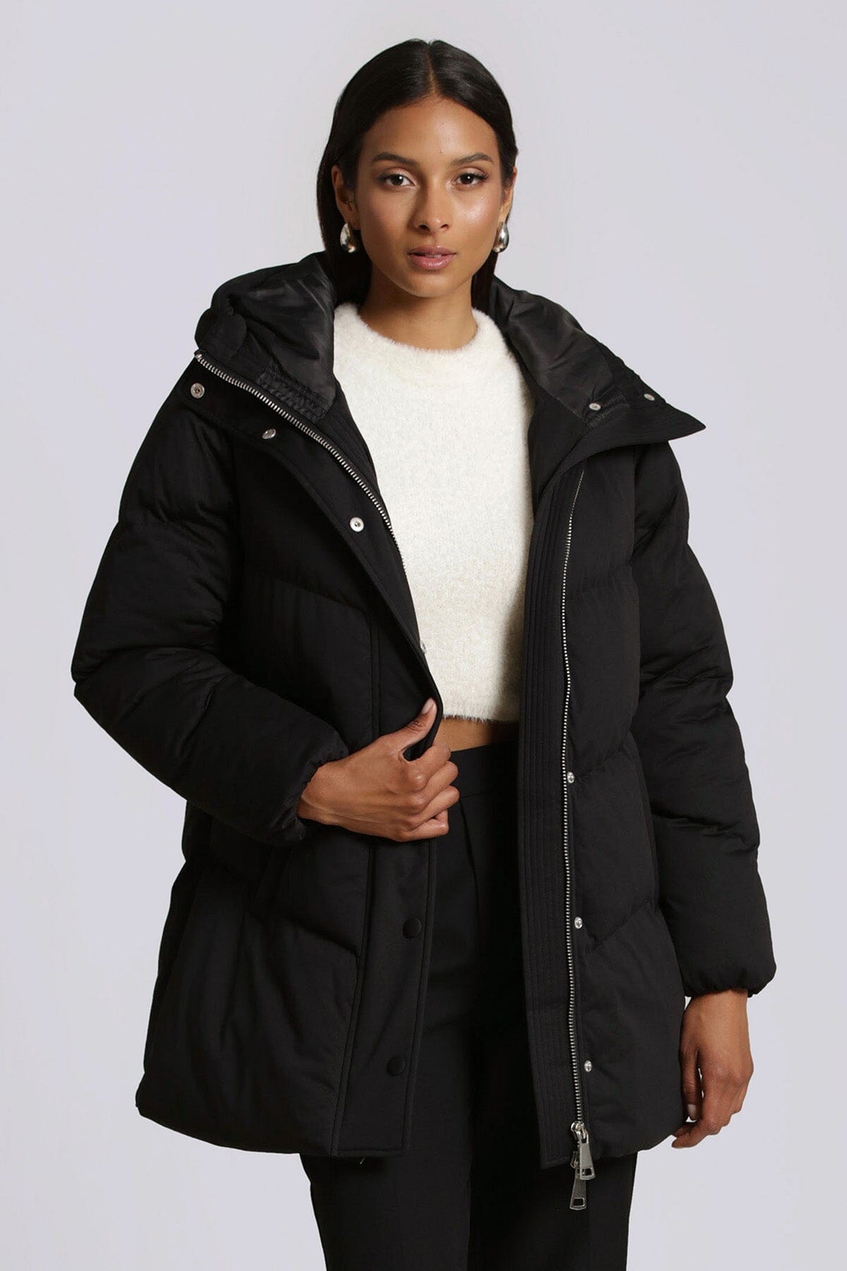 Black hooded puffer outerwear jacket with faux down thermal puff by Avec Les Filles
