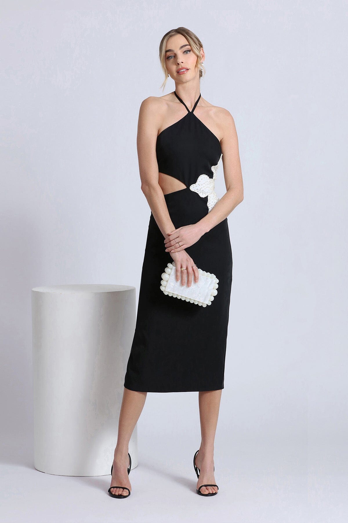 Women's figure flattering white flower embellished cut-out black halter dress for 2024 trends by Avec Les Filles