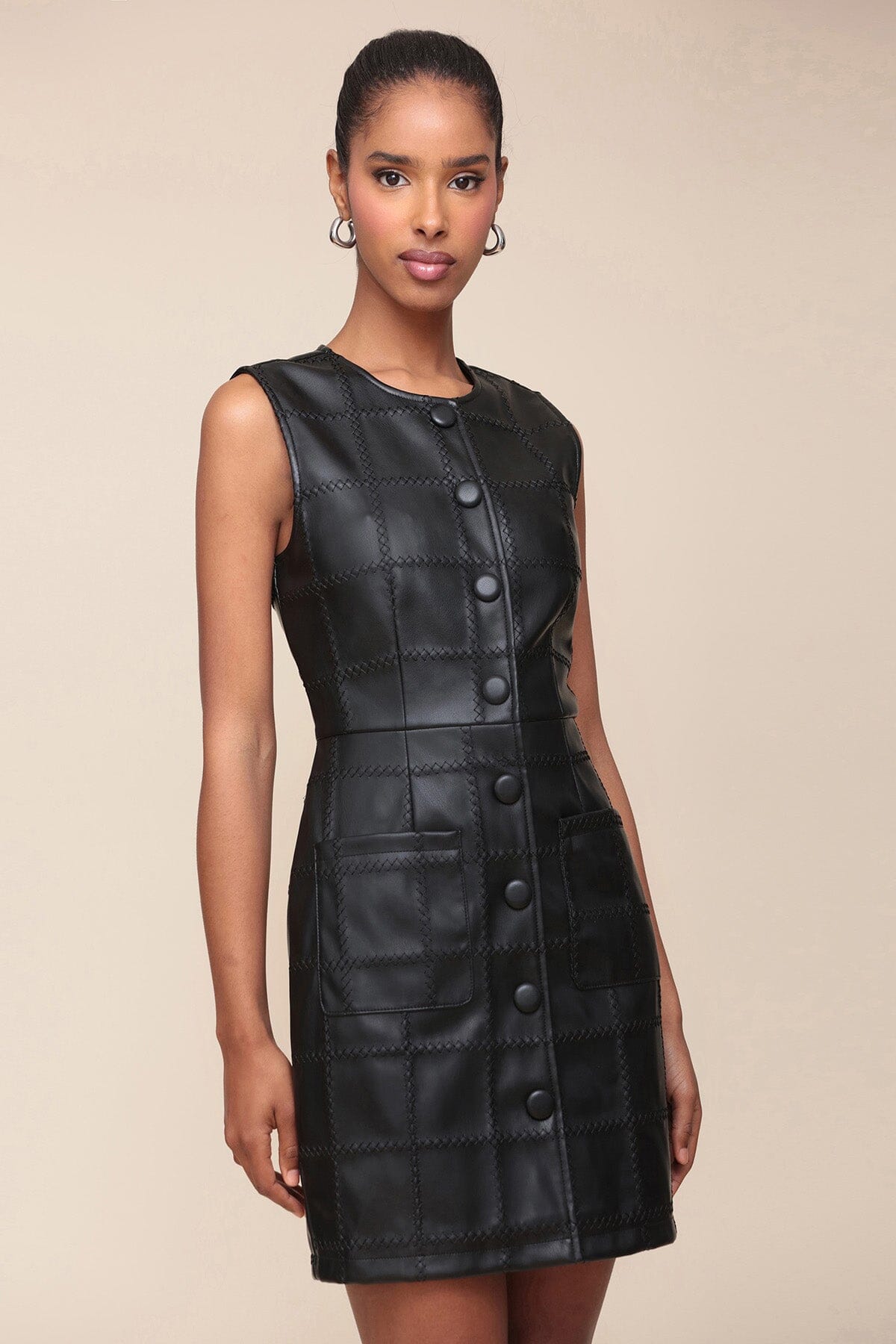 Textured faux leather black mini dress with front patch pockets, crewneck and sleeveless - Cute women's mini dresses by Avec Les Filles