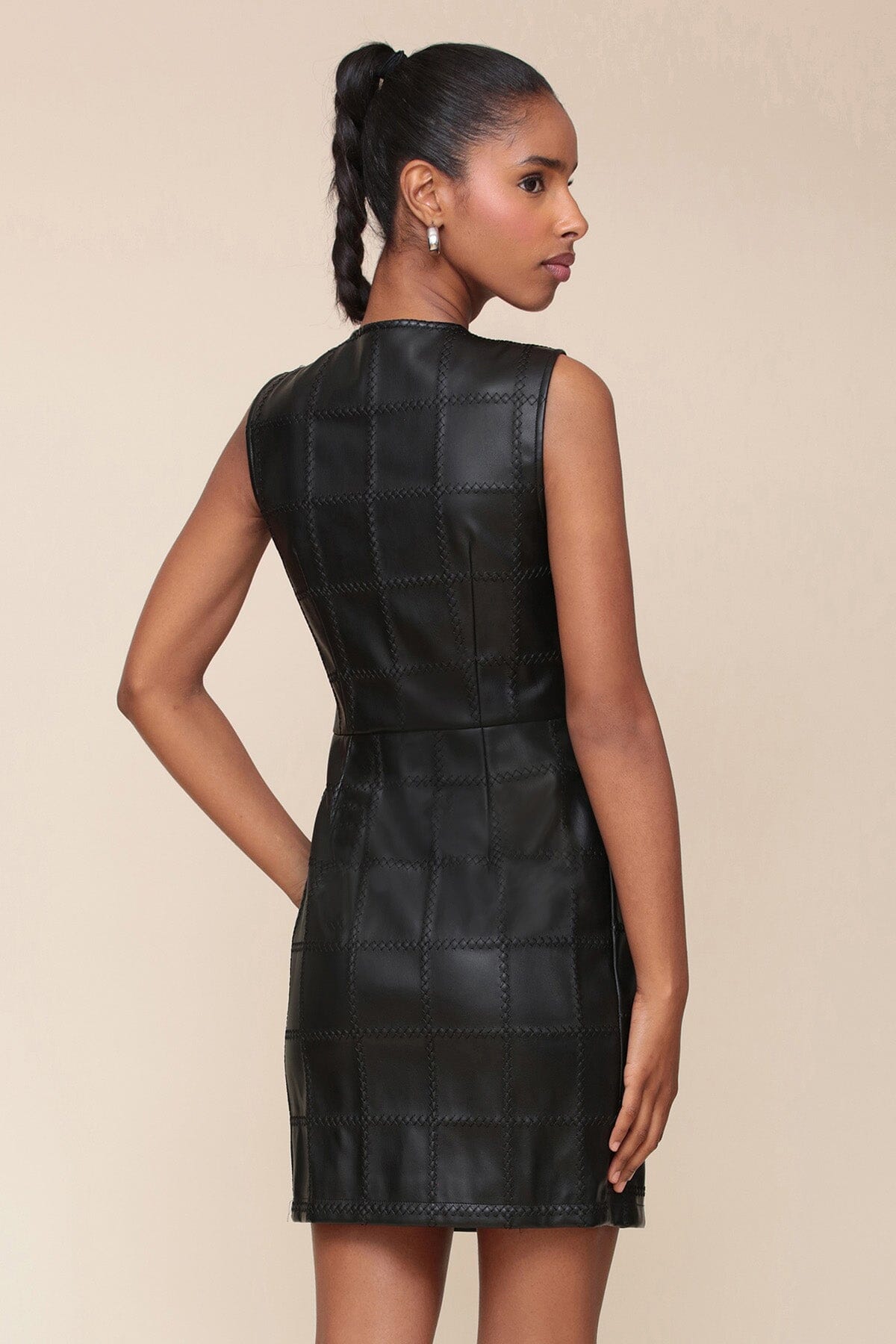 Textured faux leather black mini dress with front patch pockets, crewneck and sleeveless - Cute women's mini dresses by Avec Les Filles