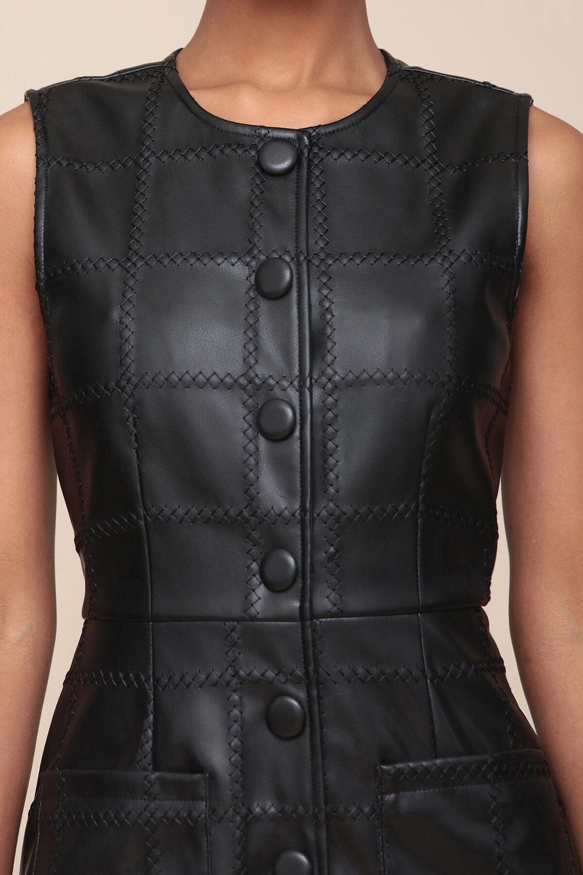 Textured faux leather black mini dress with front patch pockets, crewneck and sleeveless - Cute women's mini dresses by Avec Les Filles