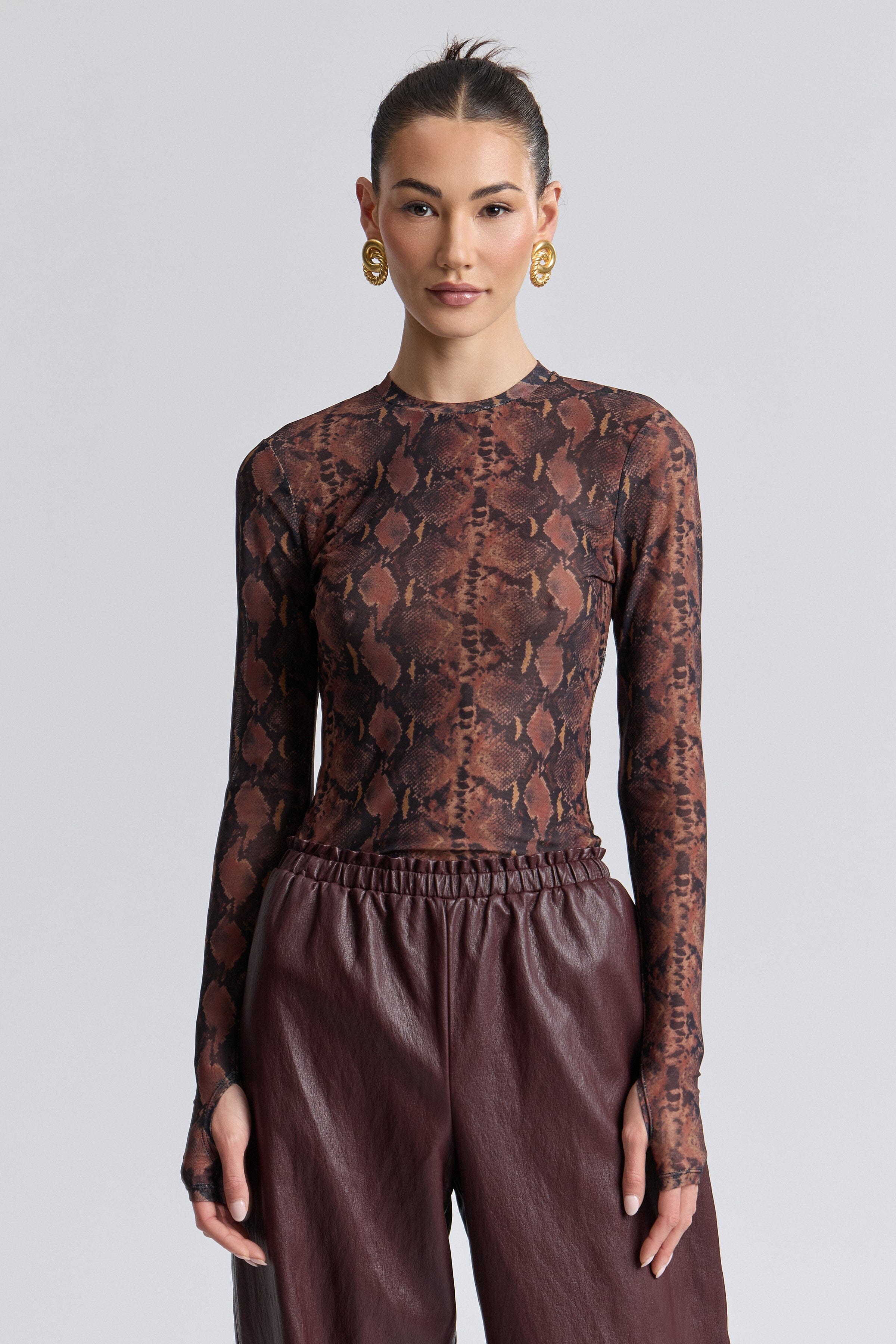 Stretch mesh long-sleeve thumbhole snake print top with crew neck - Shop women's printed tops by Avec Les Filles.