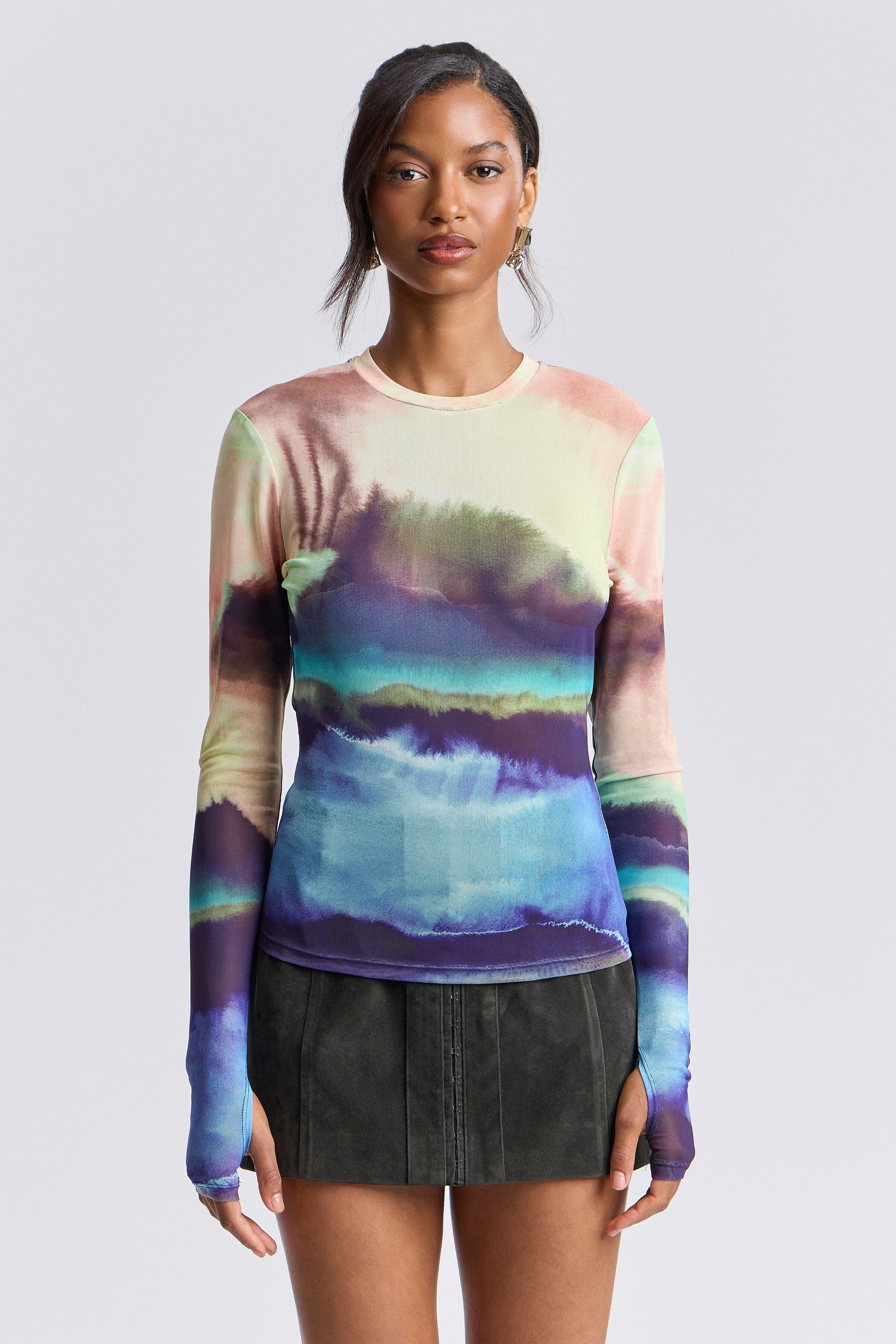 Colorful printed mesh long sleeve top with crew neck and extra-long thumbhole sleeves by Avec Les Filles.
