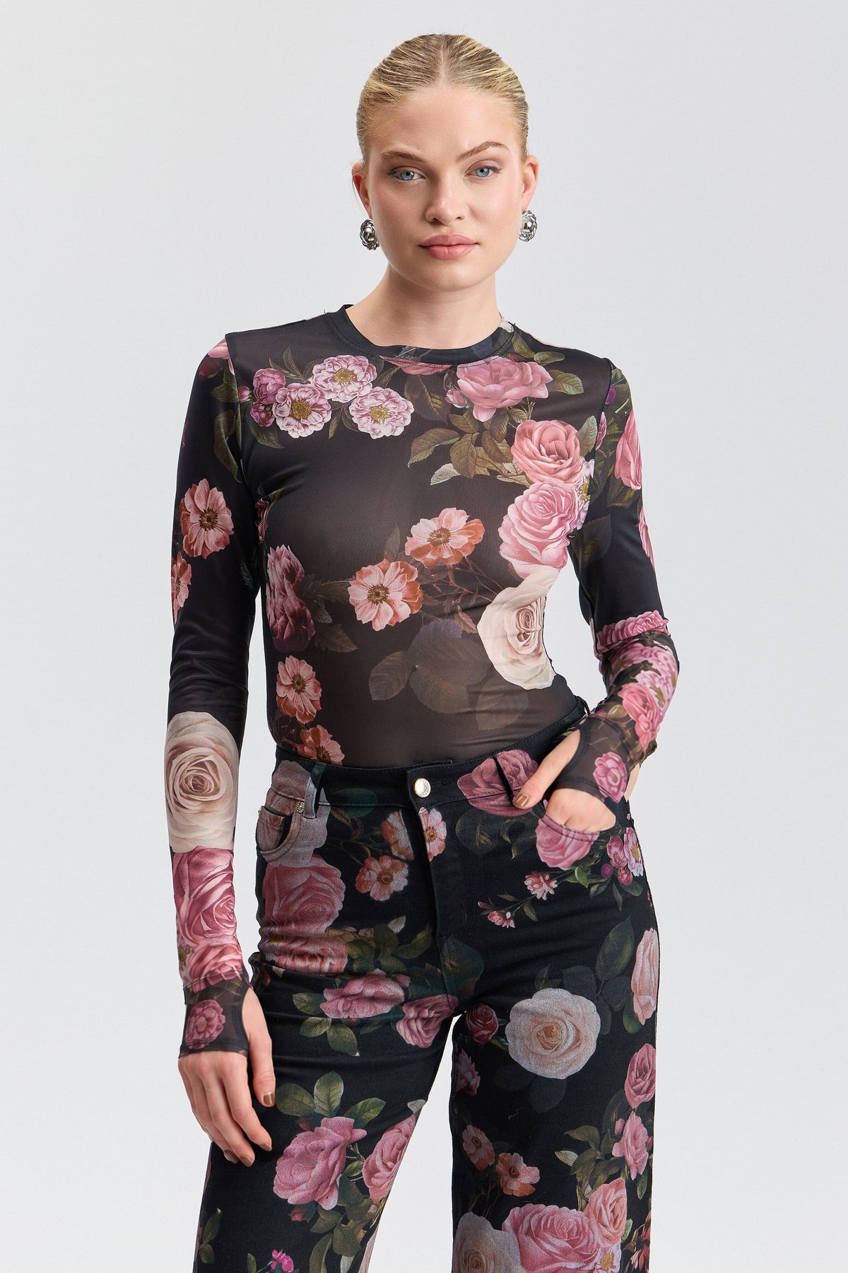 Thumbholes long-sleeve printed black mesh top with round neck. Shop women's cute floral mesh tops by Avec Les Filles.