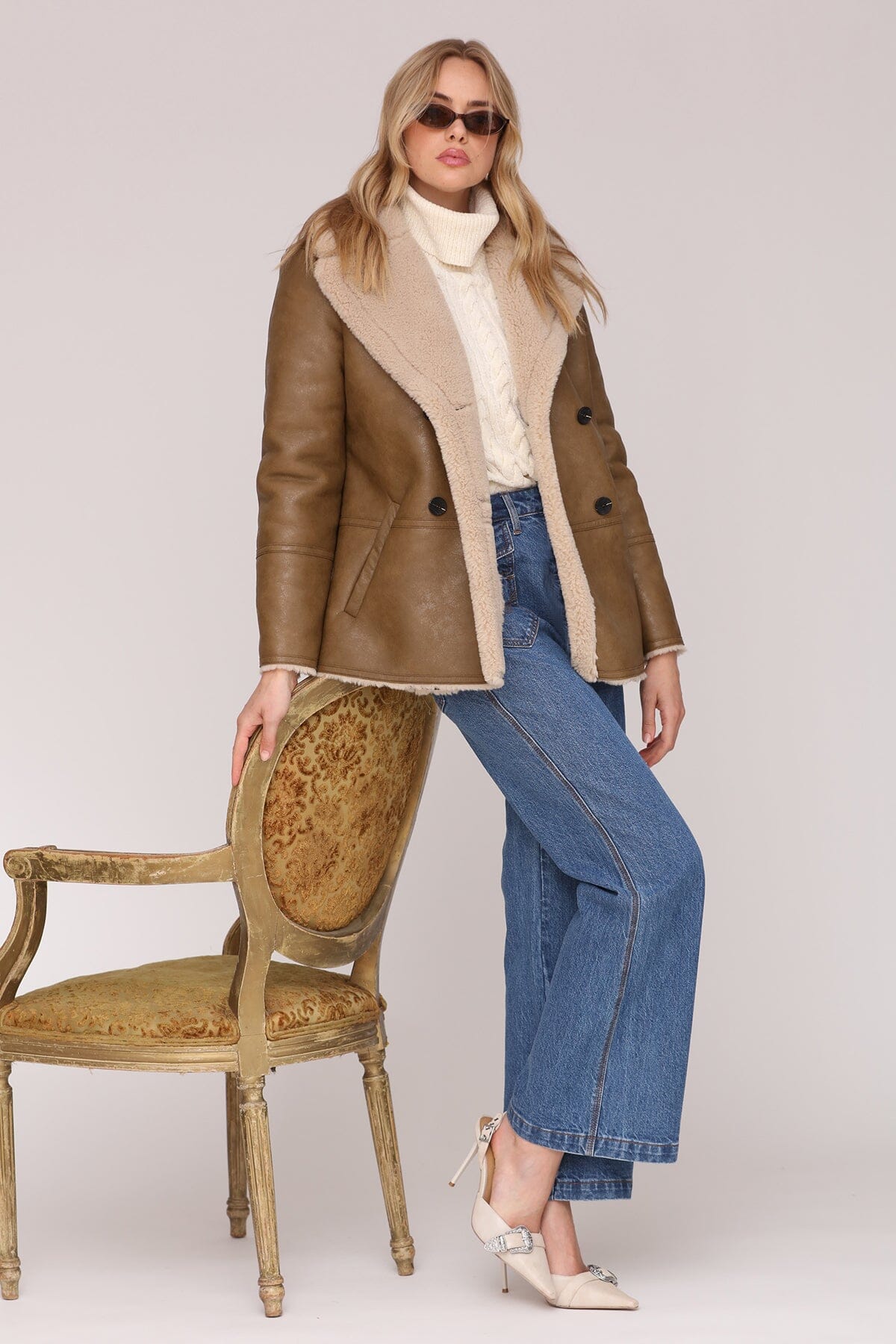Brown and cream faux leather shearling double-breasted coat with an oversized notched collar and welt pockets - Shop cute women’s coats by Avec Les Filles