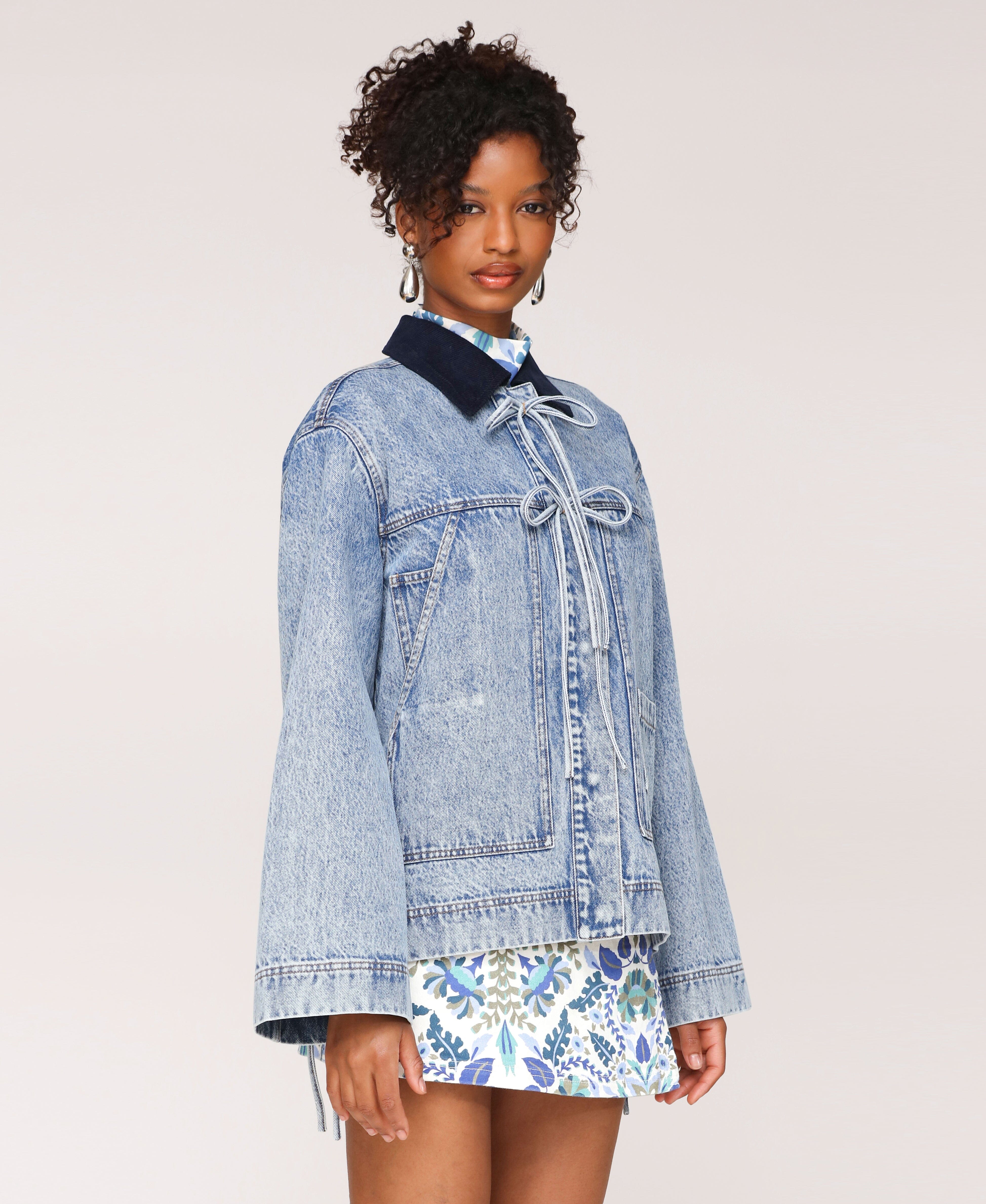 Ovesize women denim jacket with patch pockets and front bow detail. Shop designer jackets by Avec Les Filles