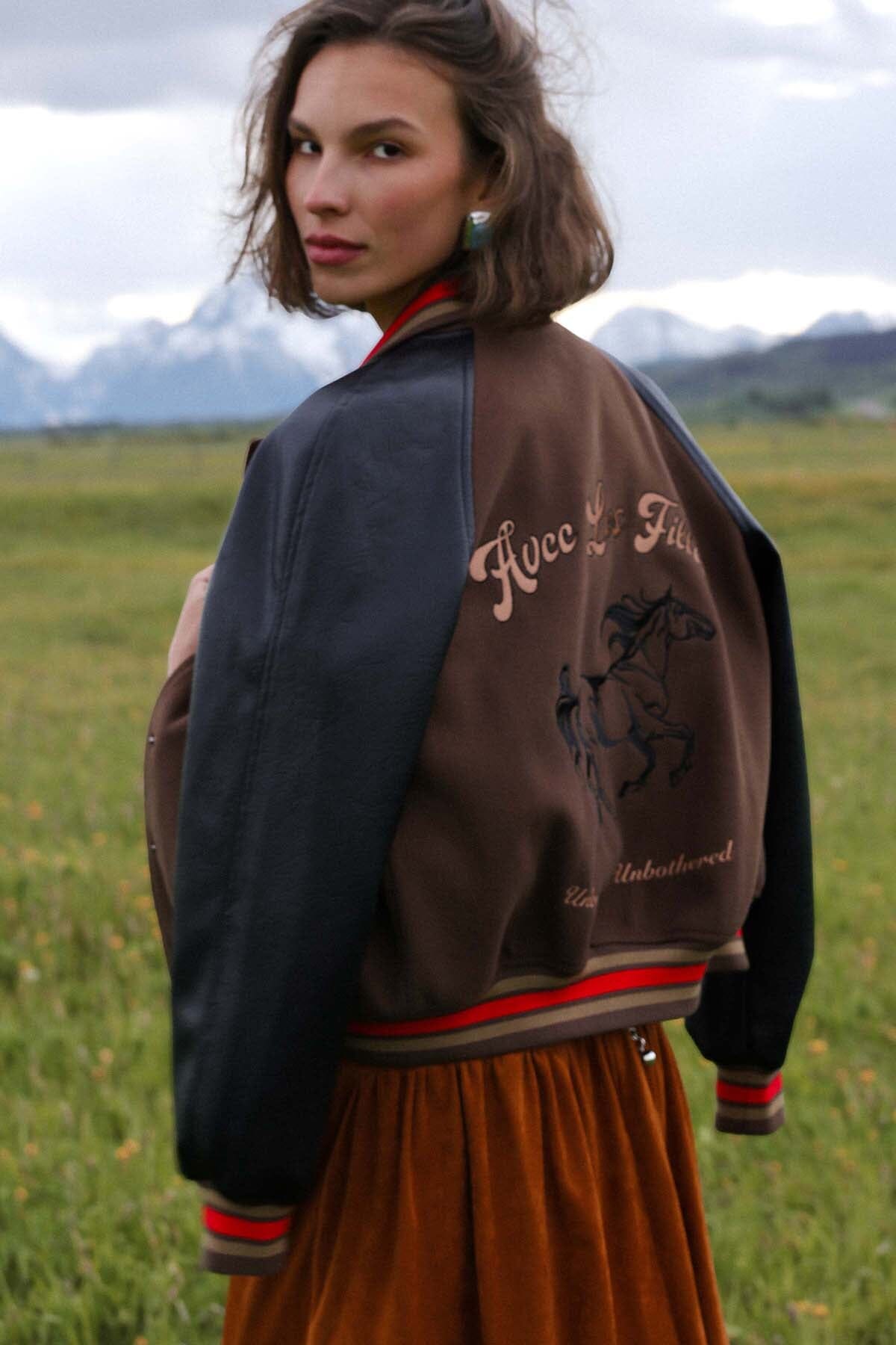 Novelty rodeo brown black varsity bomber jacket with snap‑button front, raglan faux‑leather sleeves and striped rib collar - Cute women's jackets by Avec Les Filles