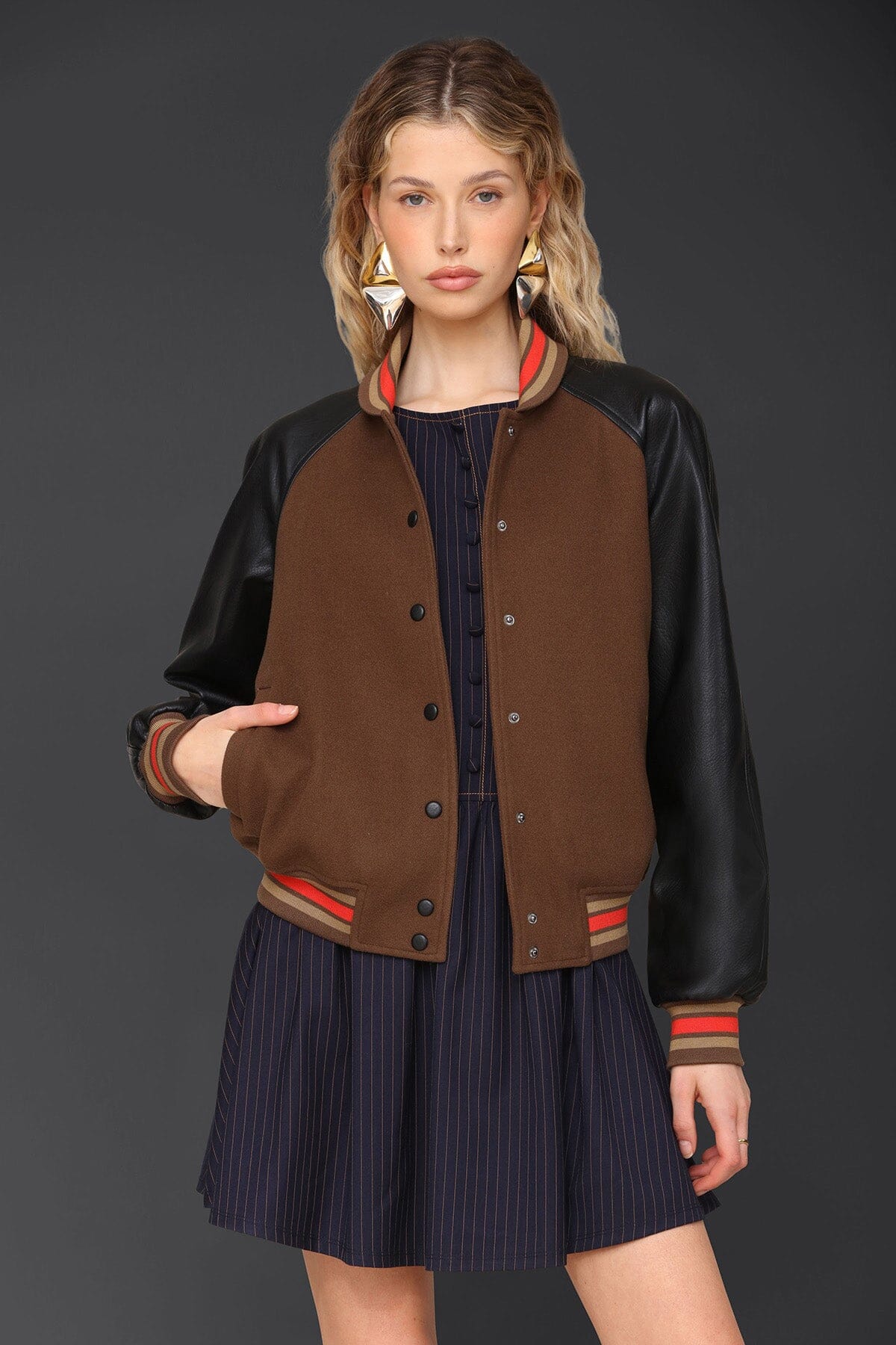 Novelty rodeo brown black varsity bomber jacket with snap‑button front, raglan faux‑leather sleeves and striped rib collar - Cute women's jackets by Avec Les Filles