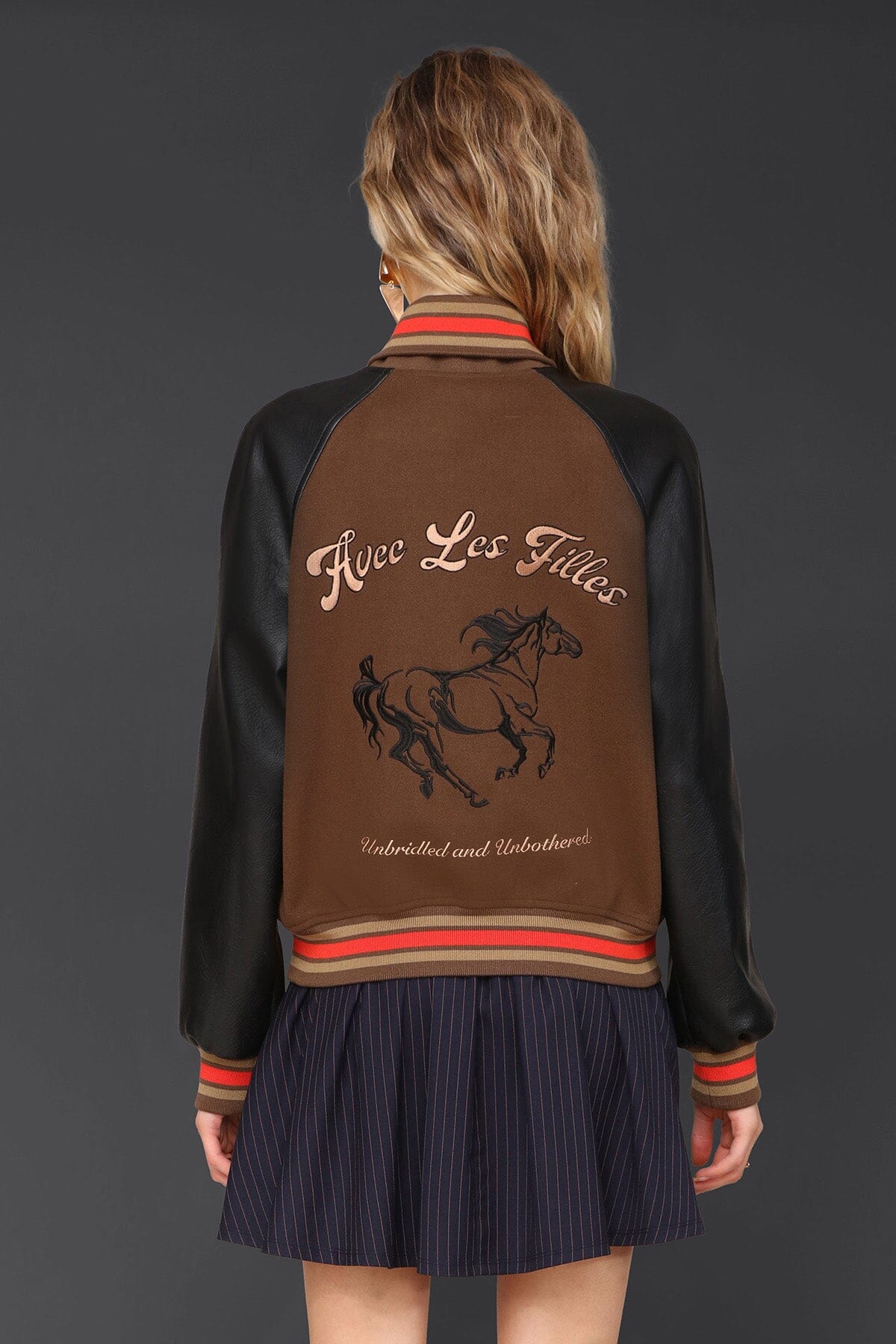 Novelty rodeo brown black varsity bomber jacket with snap‑button front, raglan faux‑leather sleeves and striped rib collar - Cute women's jackets by Avec Les Filles