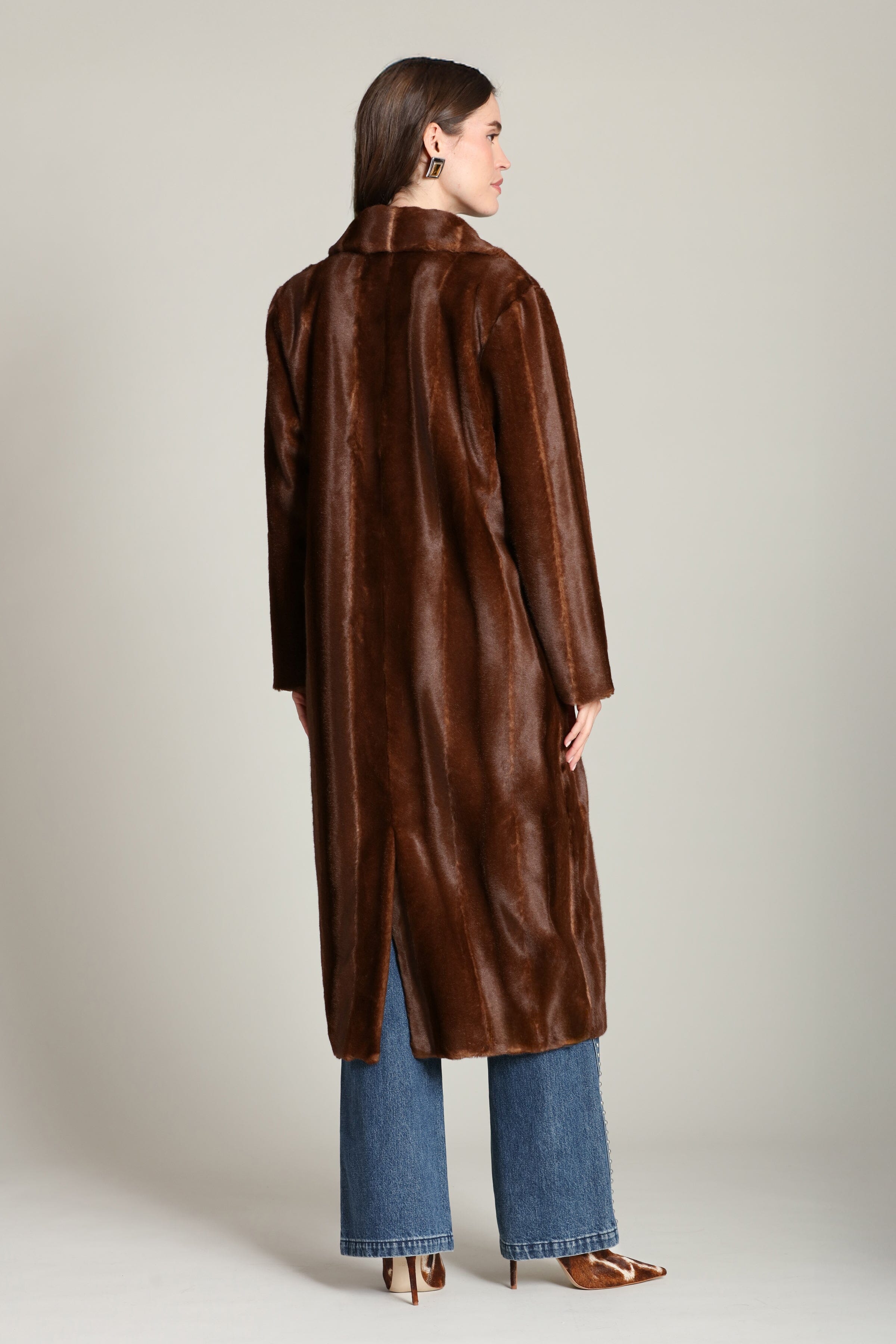 Striped faux mink fur brown button-front long coat with notched lapel collar and side flap pockets. Shop cute women's long fake fur coats by Avec Les Filles.