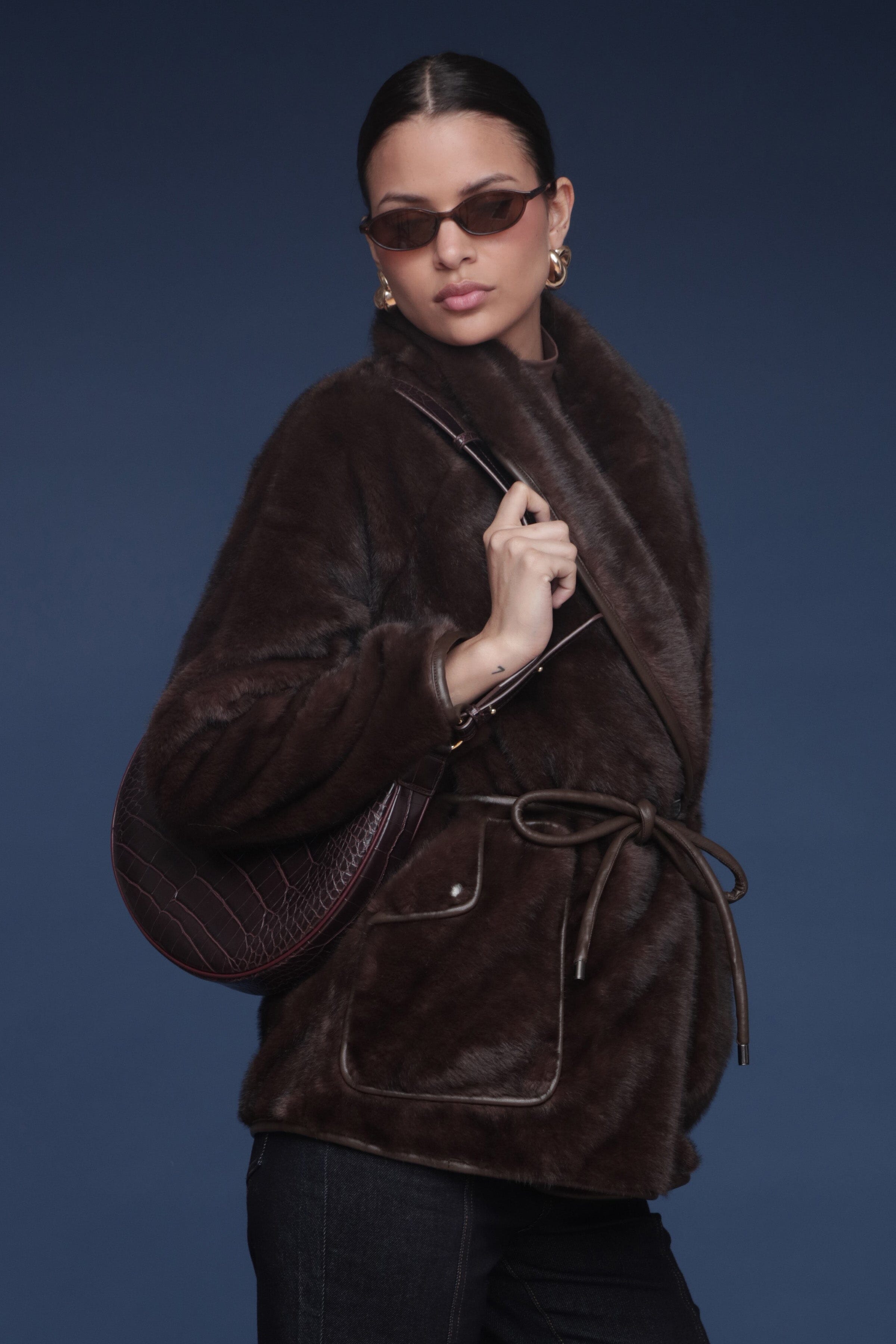 Brown faux fur button-front coat with a shawl collar, detachable belt, and side patch pockets - Shop cute women’s coats by Avec Les Filles