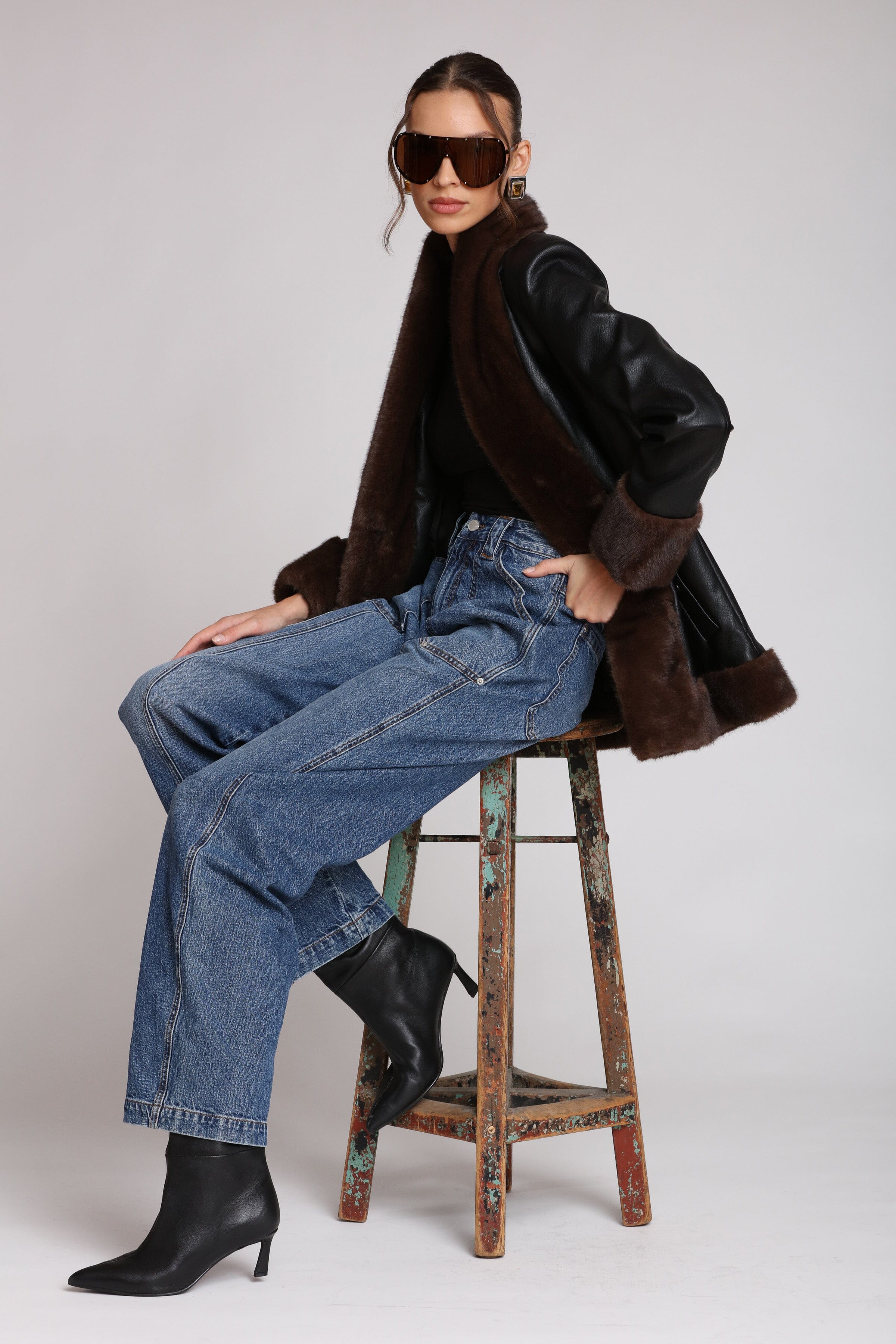 Brown fur-trimmed faux leather black jacket with open-front design, hook-and-eye closure, and side welt pockets - Shop designer women’s jackets by Avec Les Filles