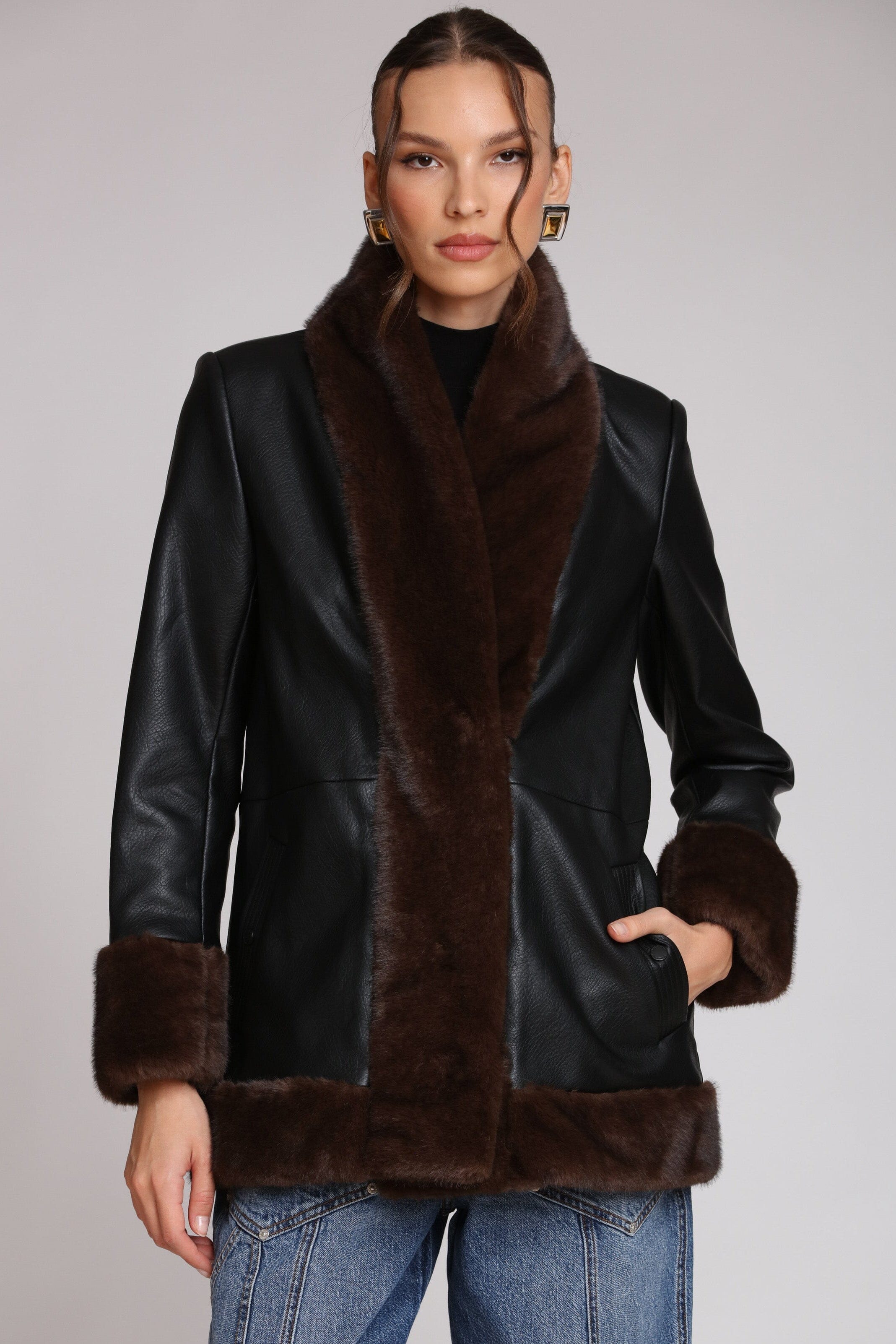 Brown fur-trimmed faux leather black jacket with open-front design, hook-and-eye closure, and side welt pockets - Shop designer women’s jackets by Avec Les Filles