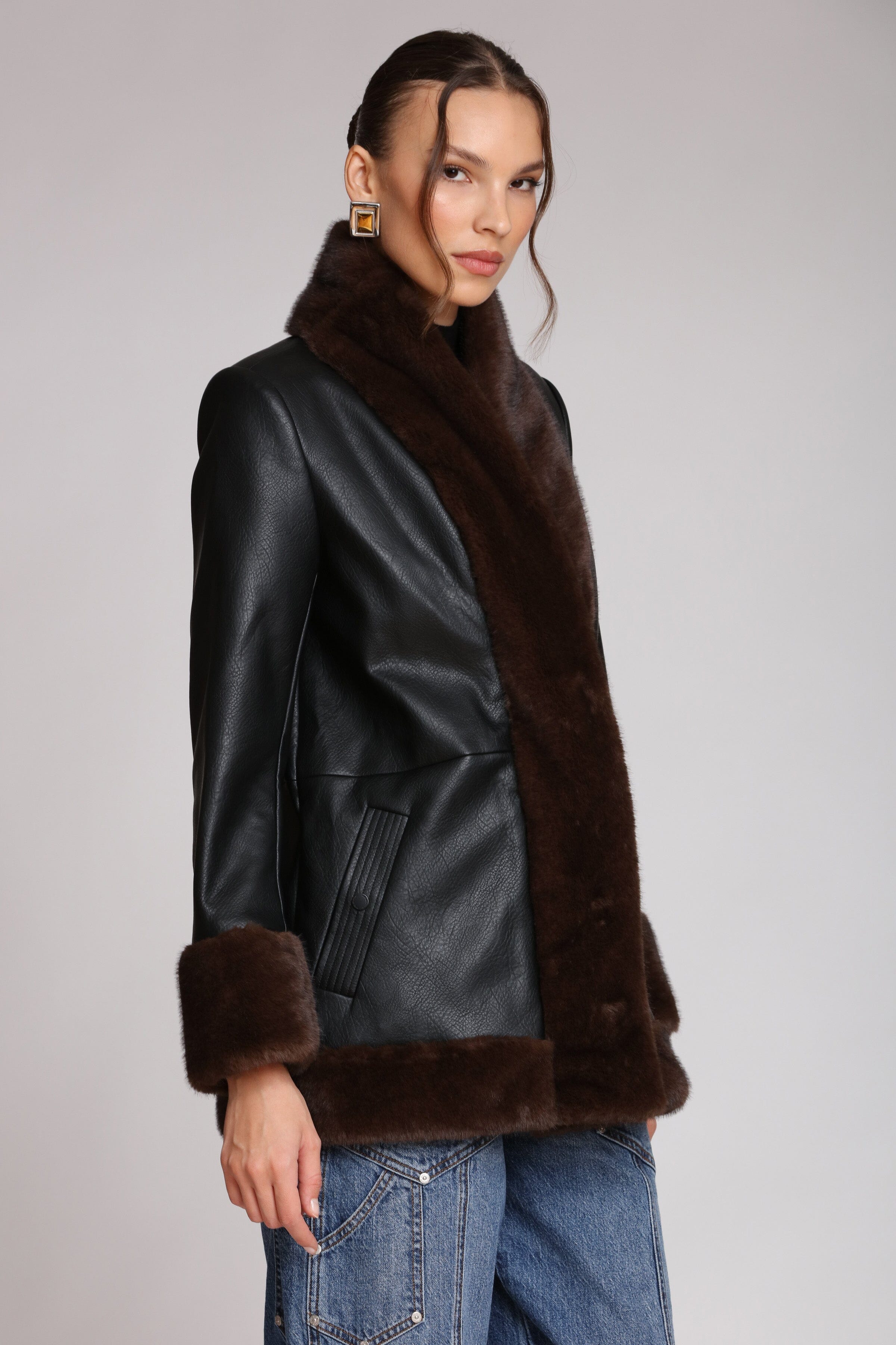 Brown fur-trimmed faux leather black jacket with open-front design, hook-and-eye closure, and side welt pockets - Shop designer jackets by Avec Les Filles